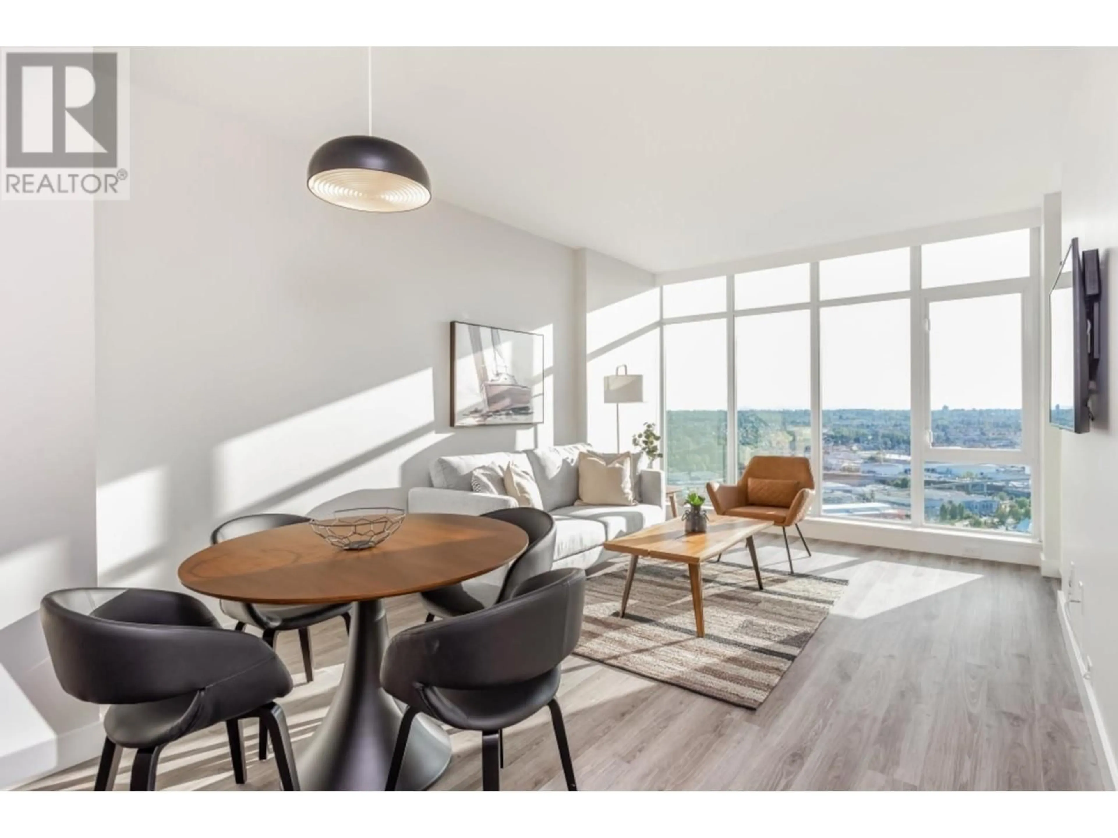 Living room with furniture, wood/laminate floor for 4103 1788 GILMORE AVENUE, Burnaby British Columbia V5C0L5