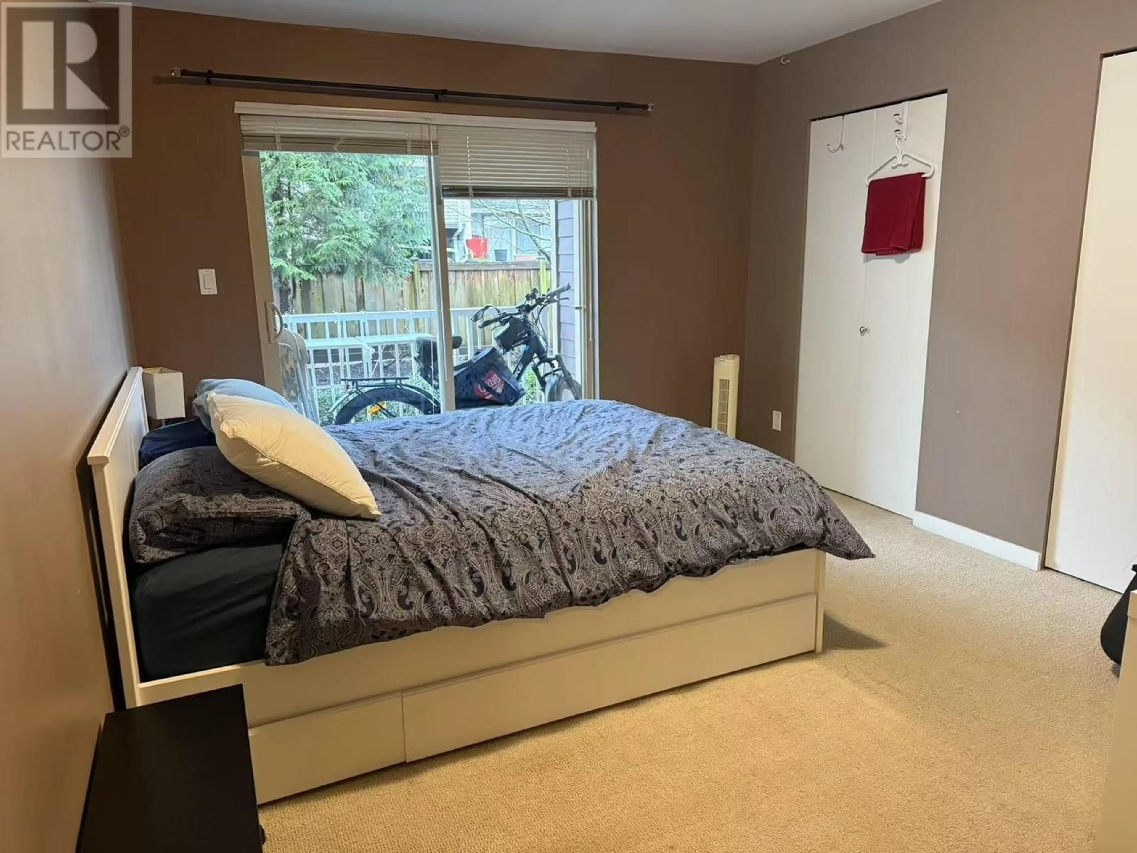 Bedroom with bed, wood/laminate floor for 209 - 7337 MACPHERSON AVENUE, Burnaby British Columbia V5J0A9