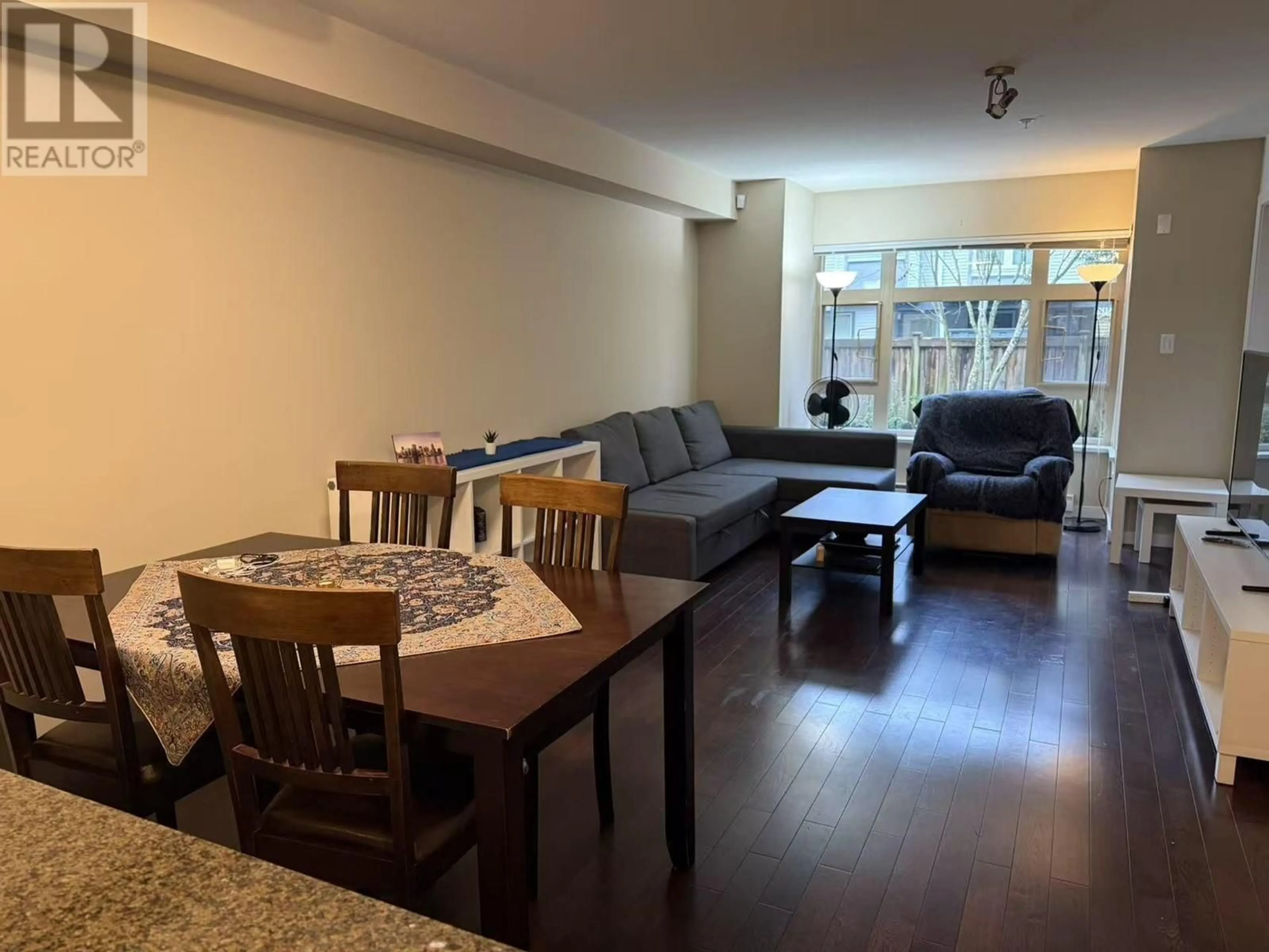 Living room with furniture, wood/laminate floor for 209 7337 MACPHERSON AVENUE, Burnaby British Columbia V5J0A9