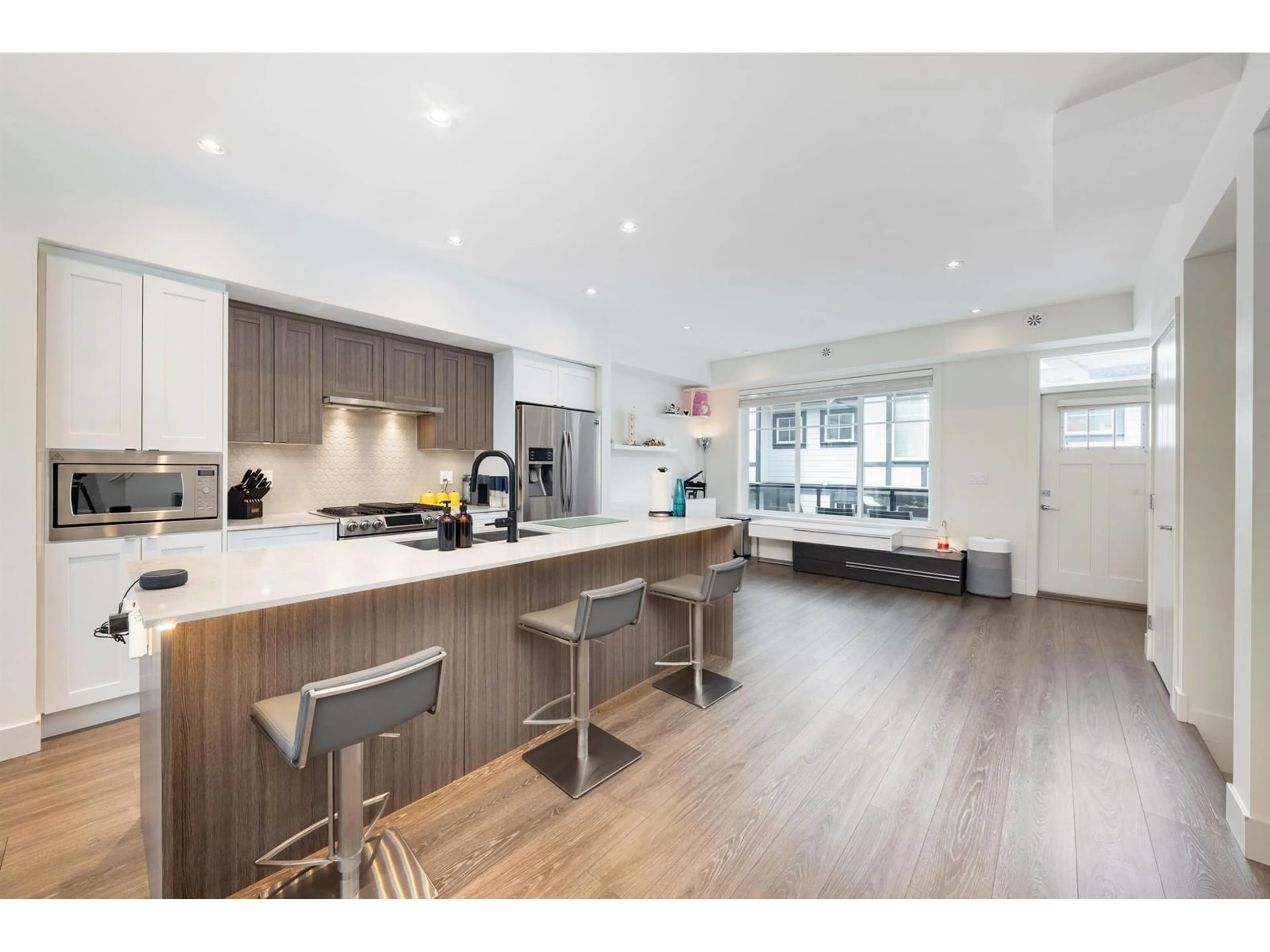Open concept kitchen, wood/laminate floor for 30 - 11188 72, Delta British Columbia V4E0A5