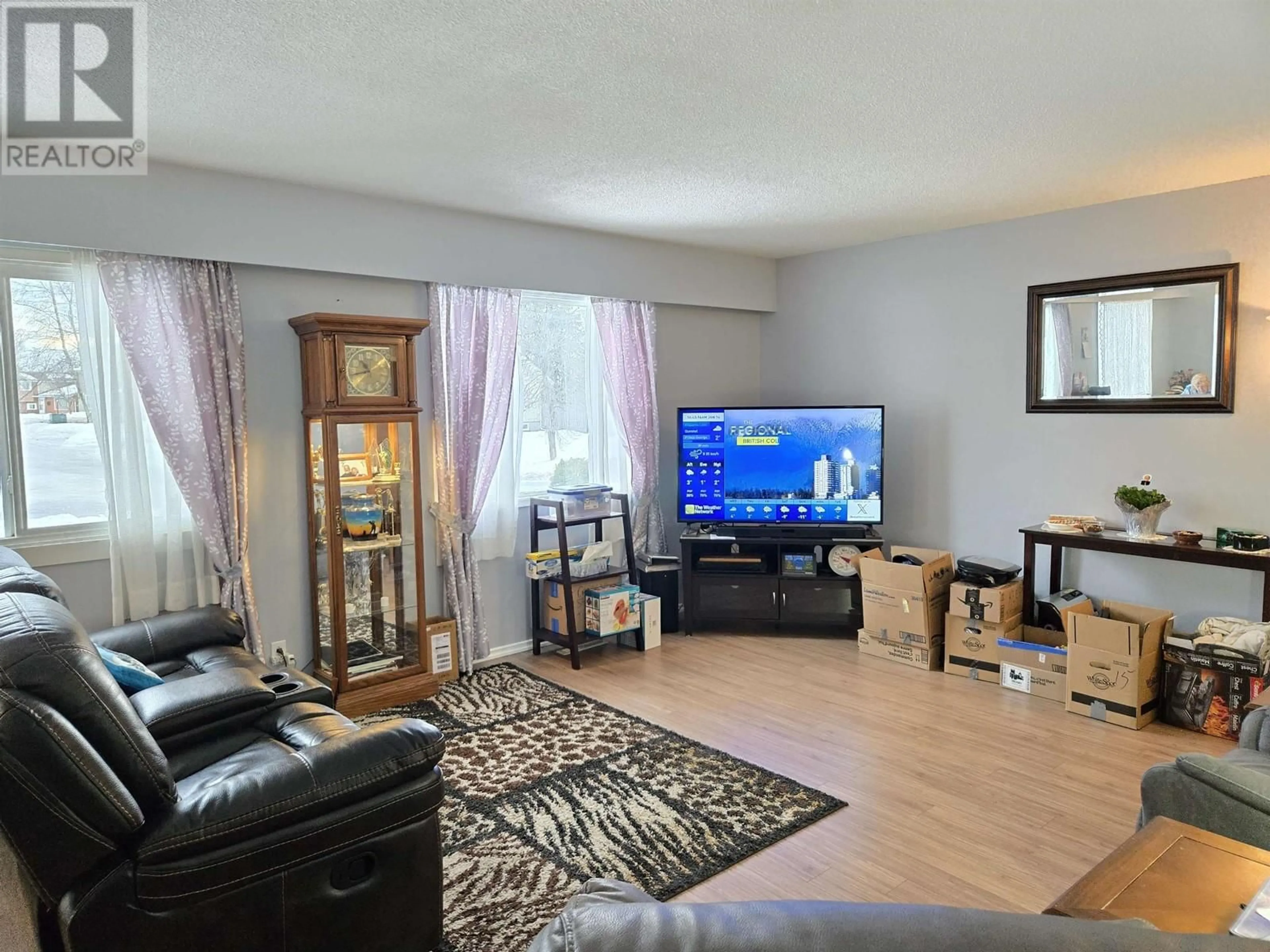 Living room with furniture, wood/laminate floor for 159 MCLEAN DRIVE, Prince George British Columbia V2M4R5