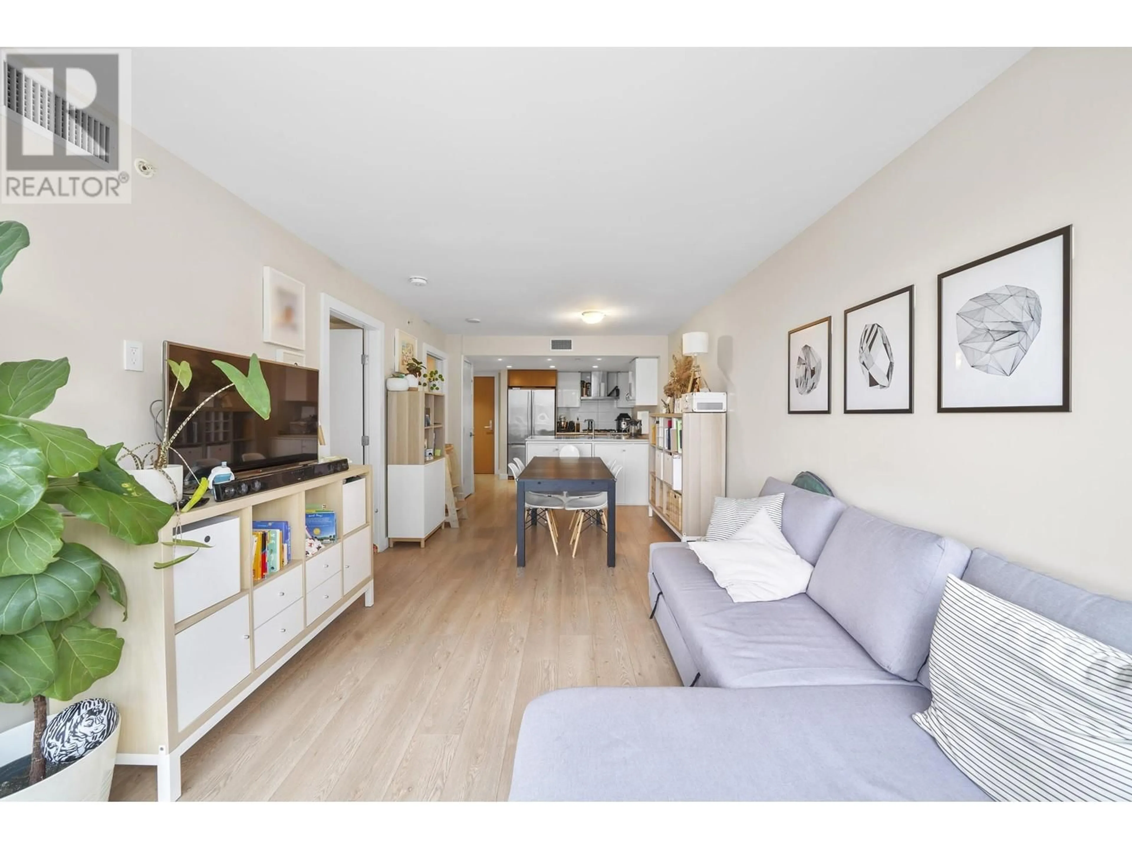 Living room with furniture, wood/laminate floor for 711 - 1618 QUEBEC STREET, Vancouver British Columbia V6A0C5