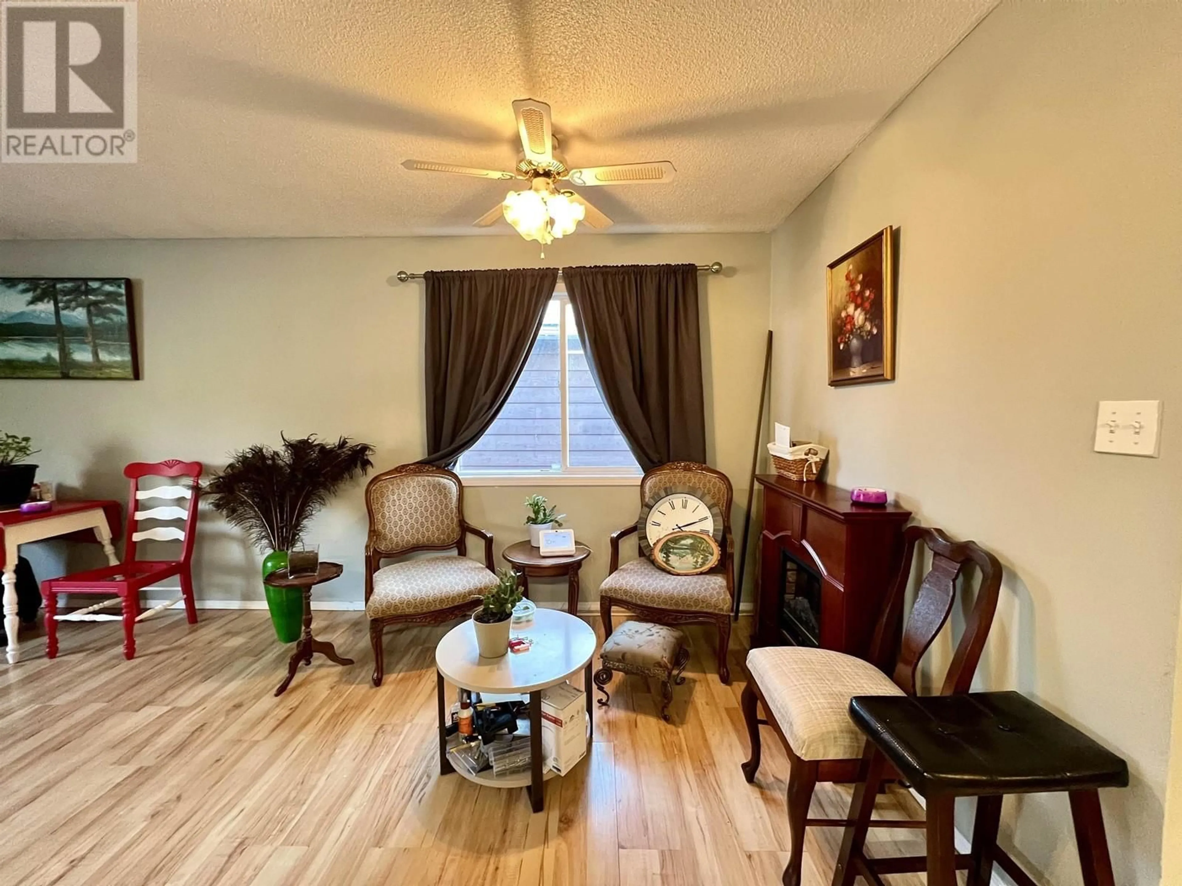 Living room with furniture, wood/laminate floor for 2087 NORWOOD STREET, Prince George British Columbia V2L1X9