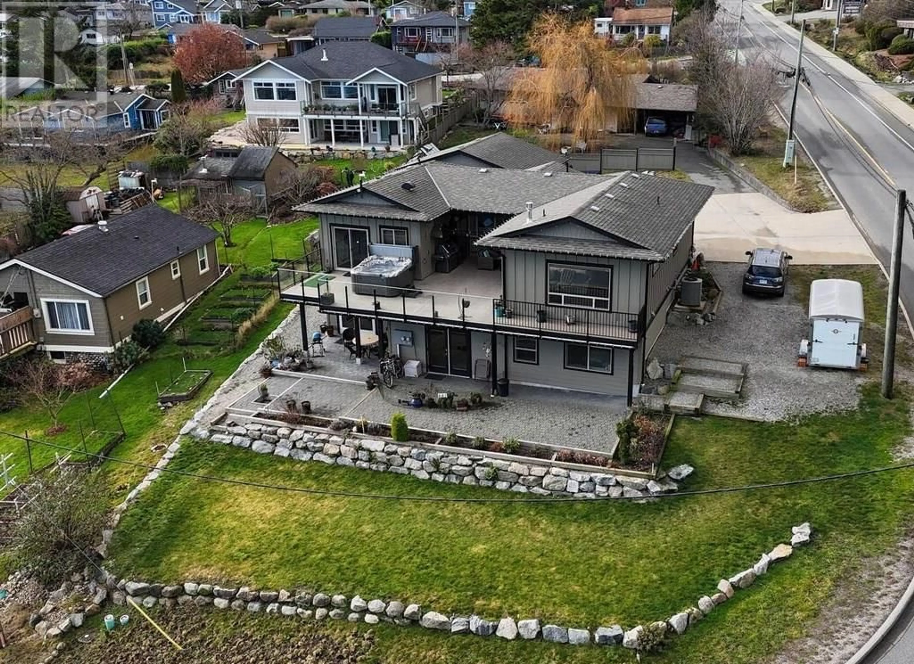 A pic from outside/outdoor area/front of a property/back of a property/a pic from drone, mountain view for 659-661 GIBSONS WAY, Gibsons British Columbia V0N1V9