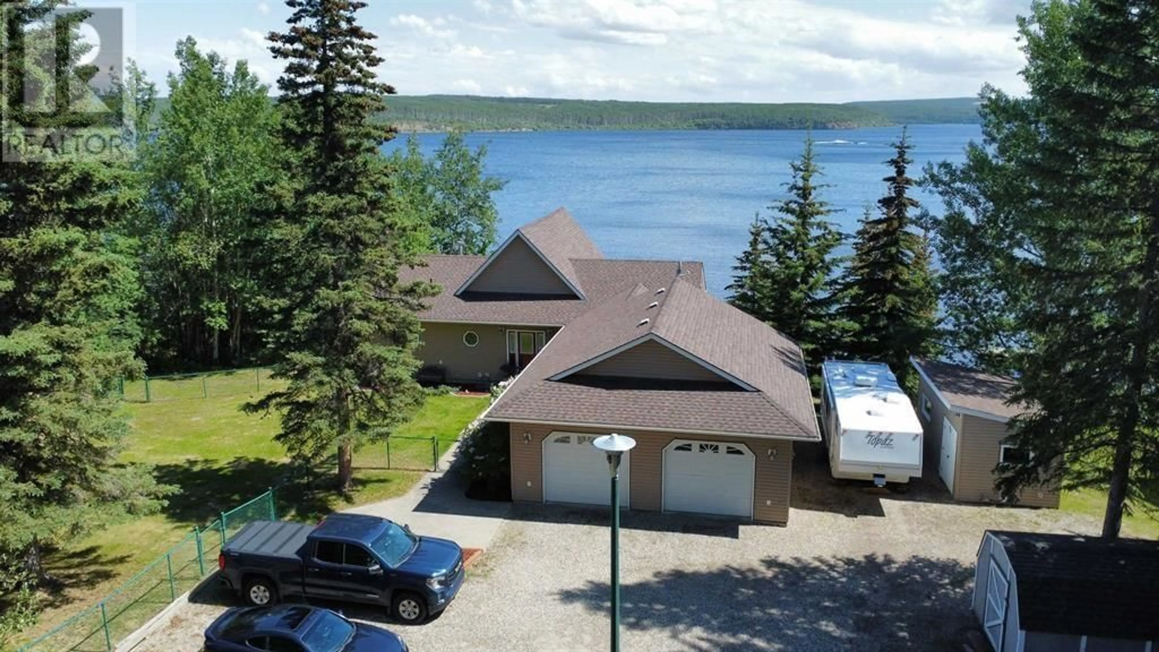 A pic from outside/outdoor area/front of a property/back of a property/a pic from drone, water/lake/river/ocean view for 13765 GOLF COURSE ROAD, Charlie Lake British Columbia V1J8K8