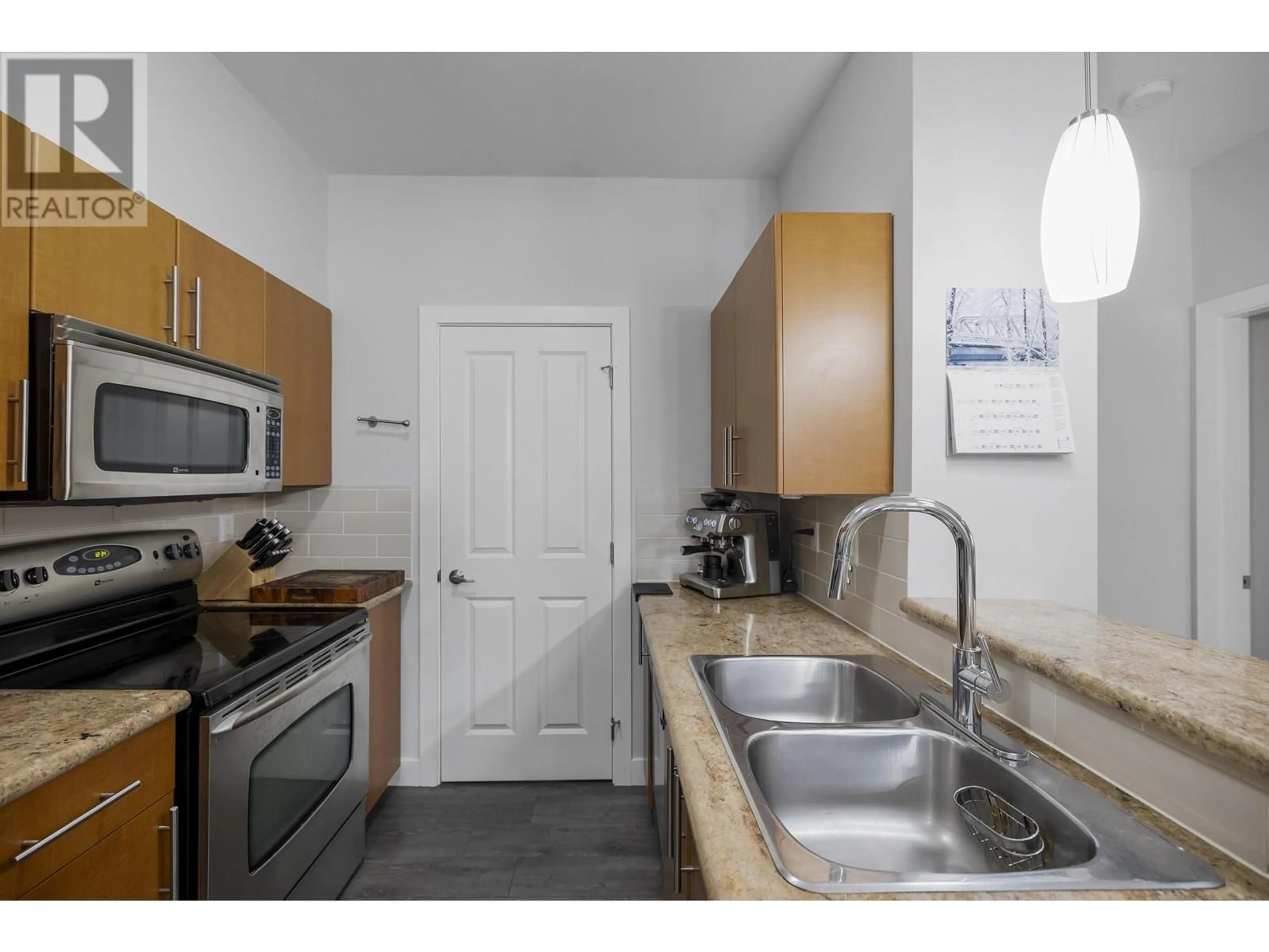 Standard kitchen, ceramic/tile floor for 206 2478 SHAUGHNESSY STREET, Port Coquitlam British Columbia V3C0A1