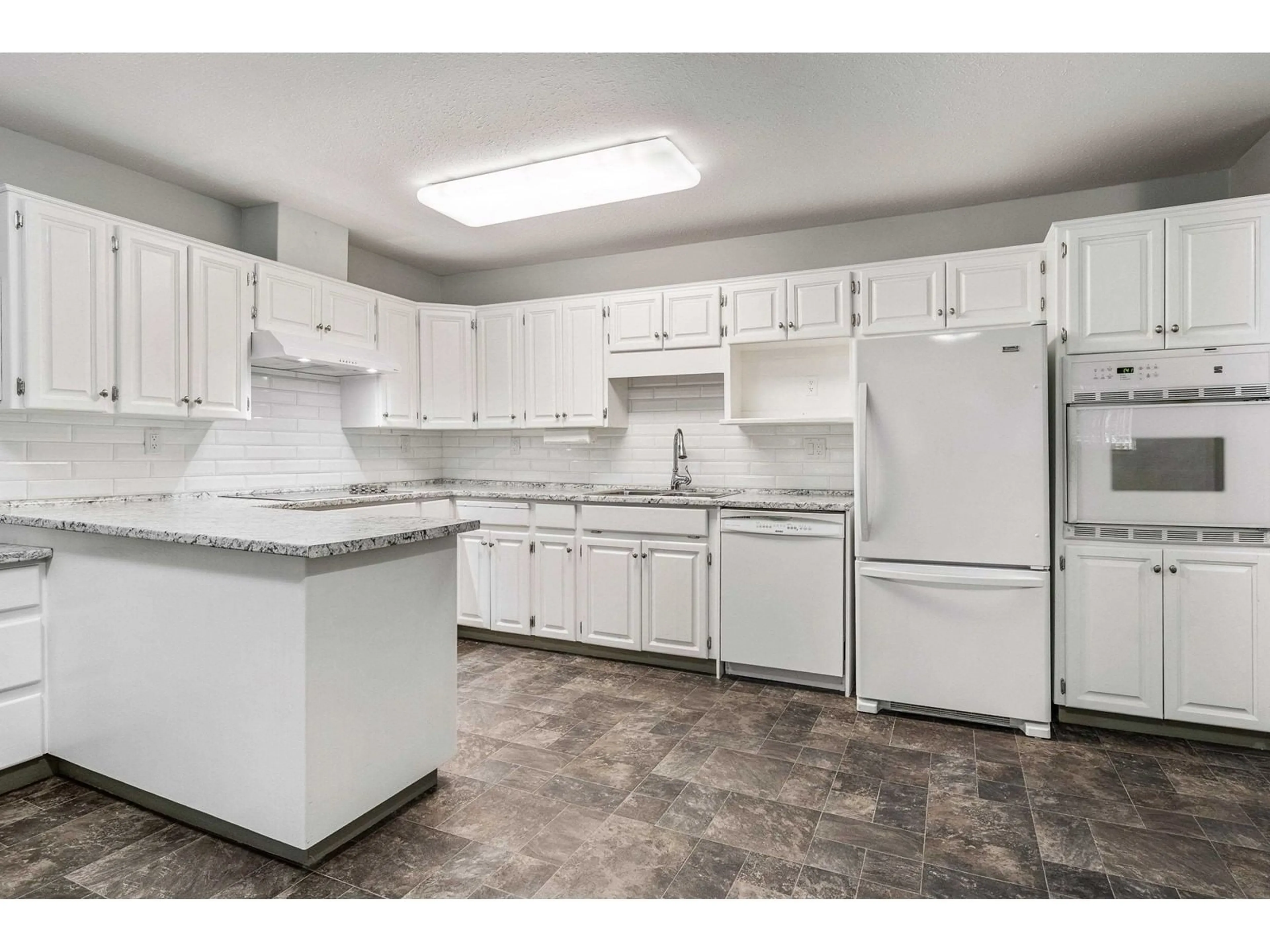 Standard kitchen, ceramic/tile floor for 208 2451 GLADWIN ROAD, Abbotsford British Columbia V2T3N8