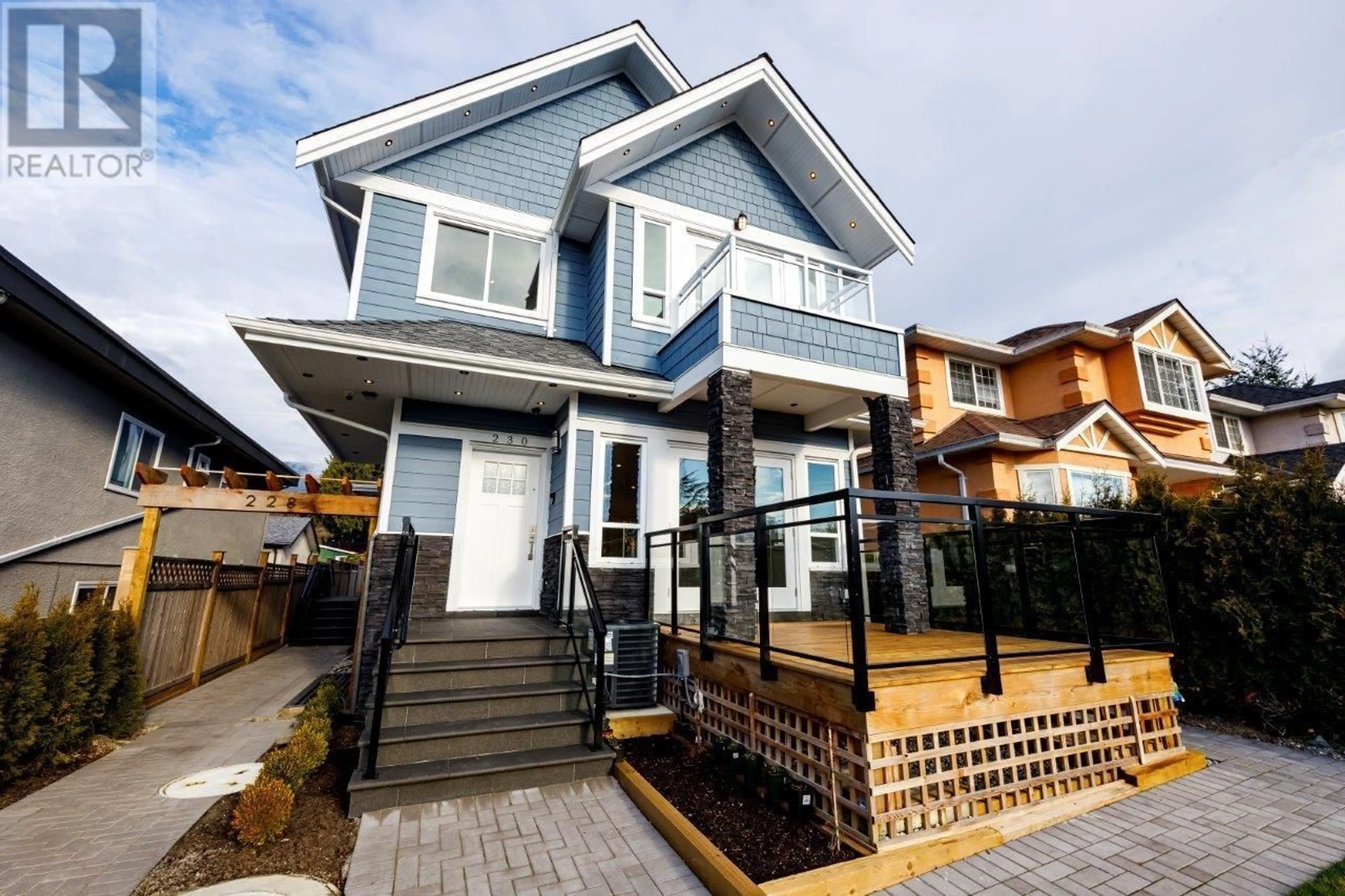 Home with vinyl exterior material, street for 230 E 20TH STREET, North Vancouver British Columbia V7L3A5