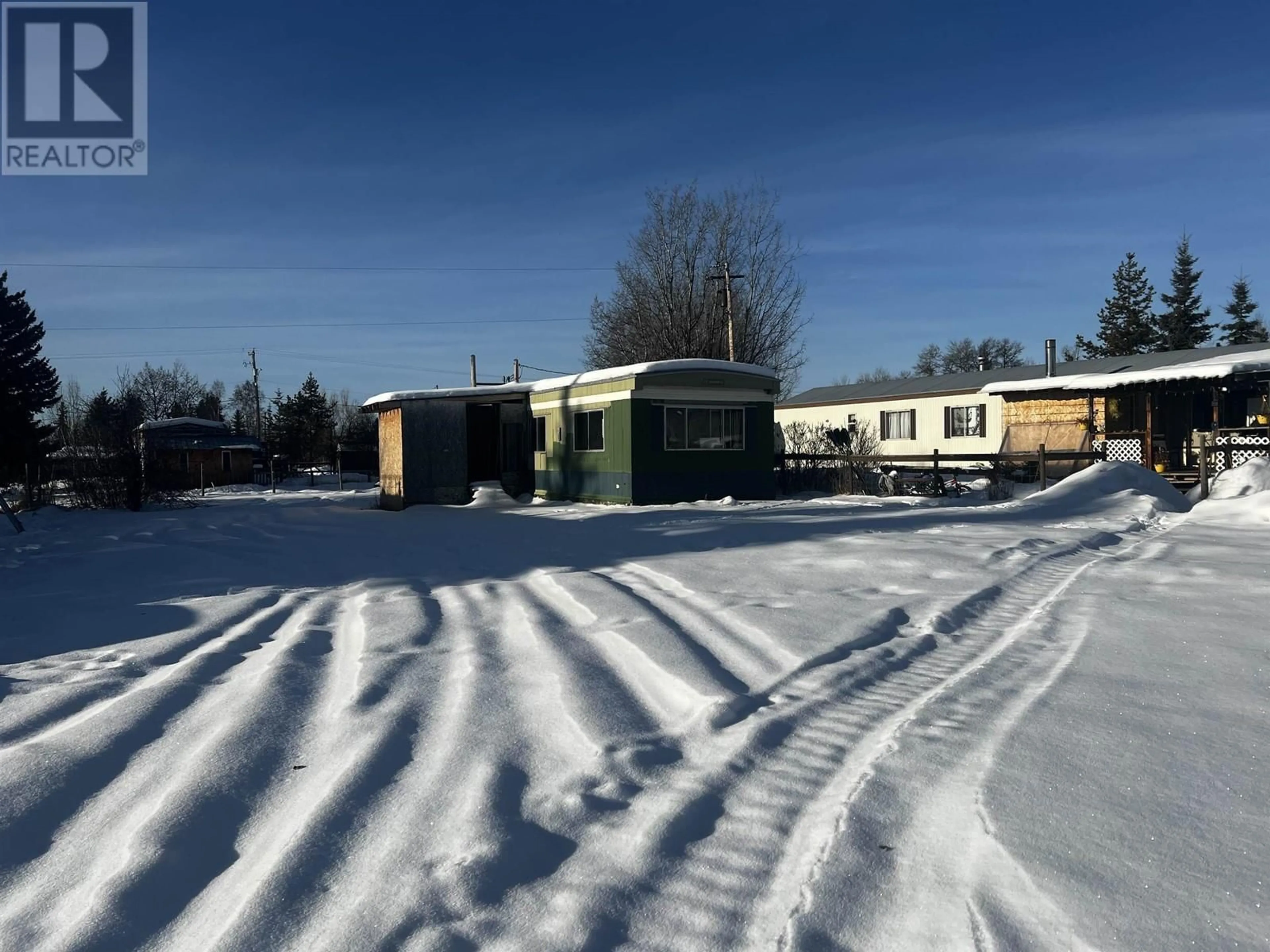 A pic from outside/outdoor area/front of a property/back of a property/a pic from drone, street for 6 724 16 HIGHWAY, Fort Fraser British Columbia V0J1N0