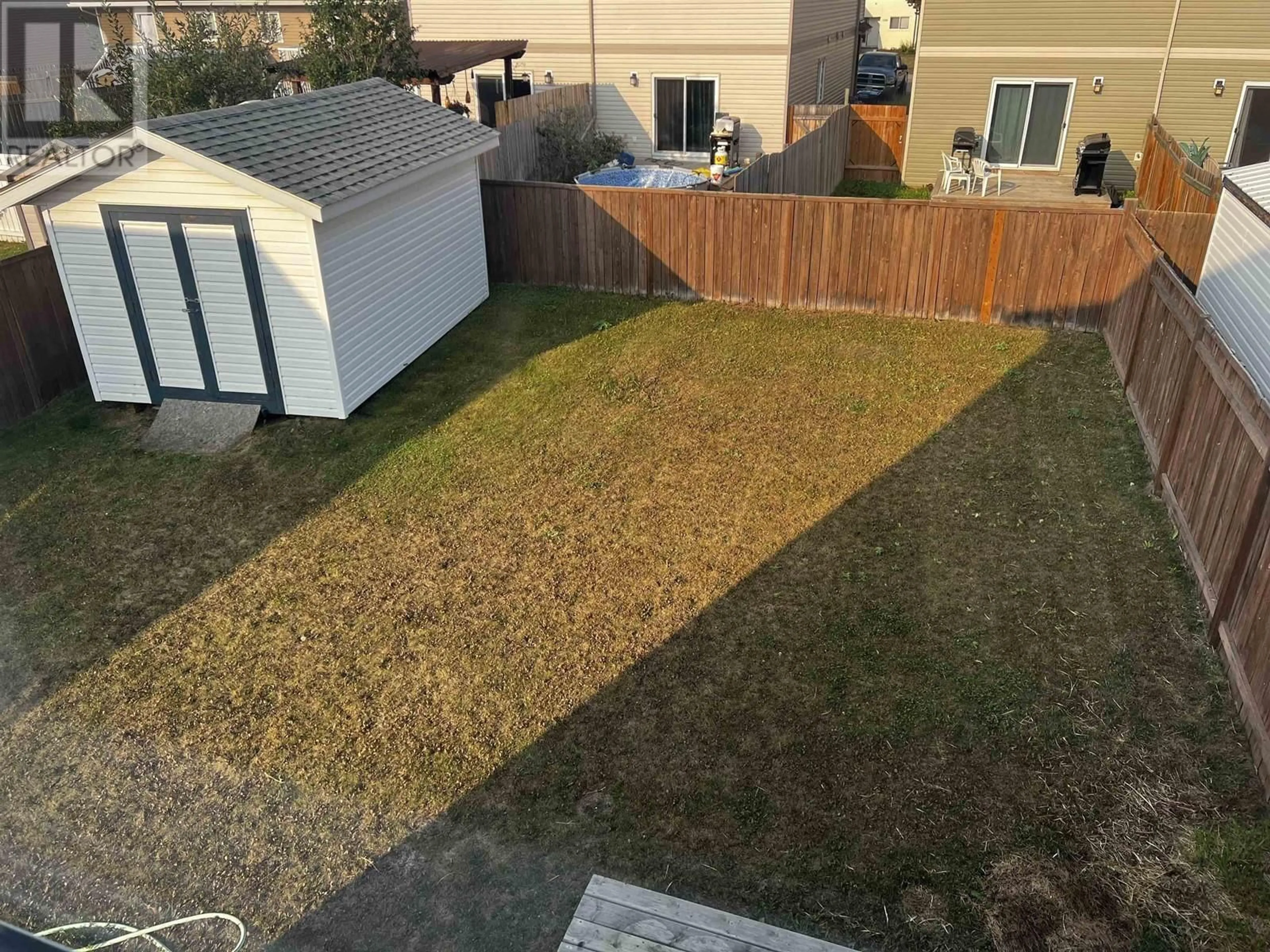 A pic from outside/outdoor area/front of a property/back of a property/a pic from drone, street for 11304 88A STREET, Fort St. John British Columbia V1J0C5