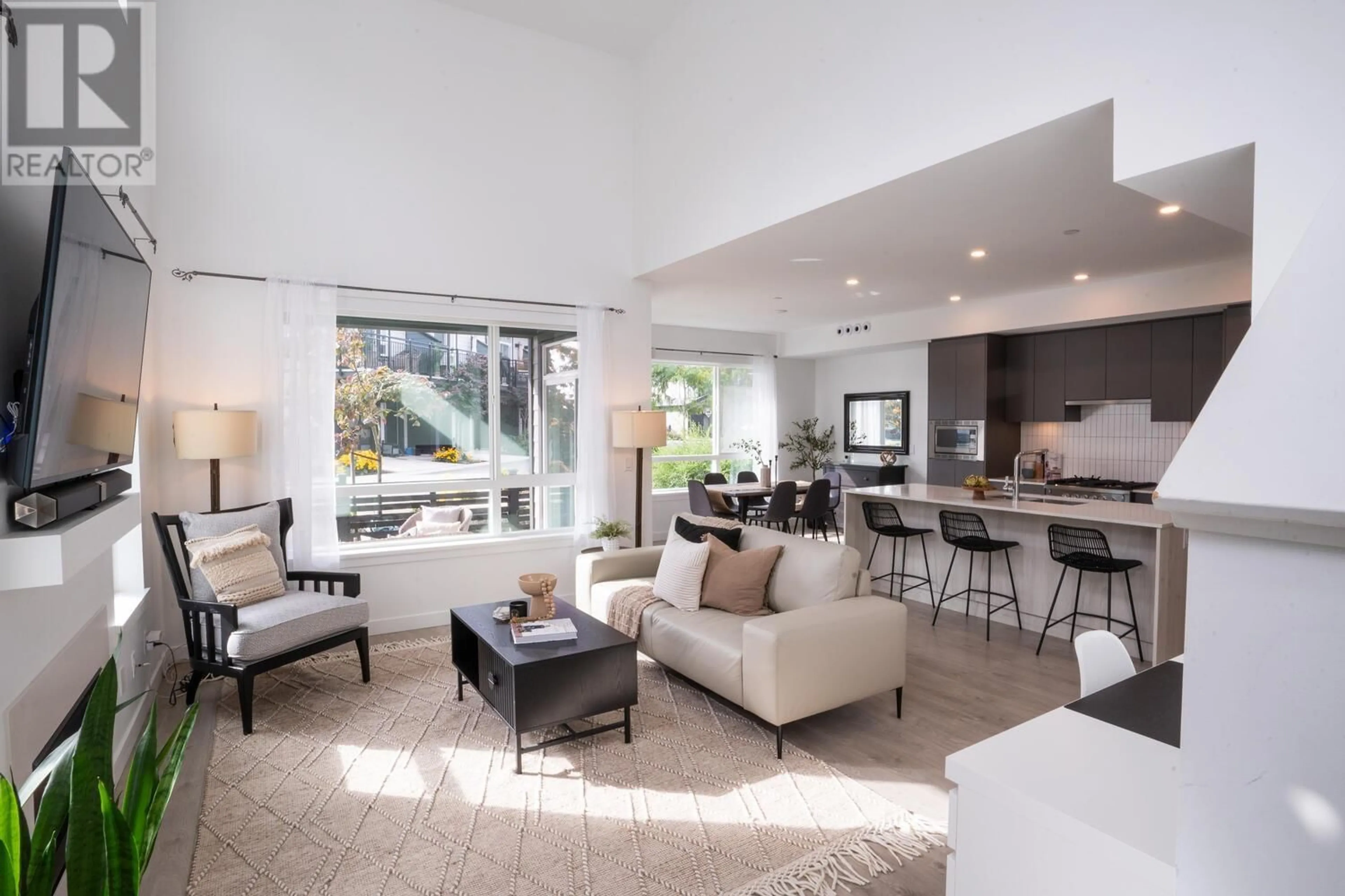 Living room with furniture, ceramic/tile floor for 4338B CORMORANT WAY, Delta British Columbia V4M0E6