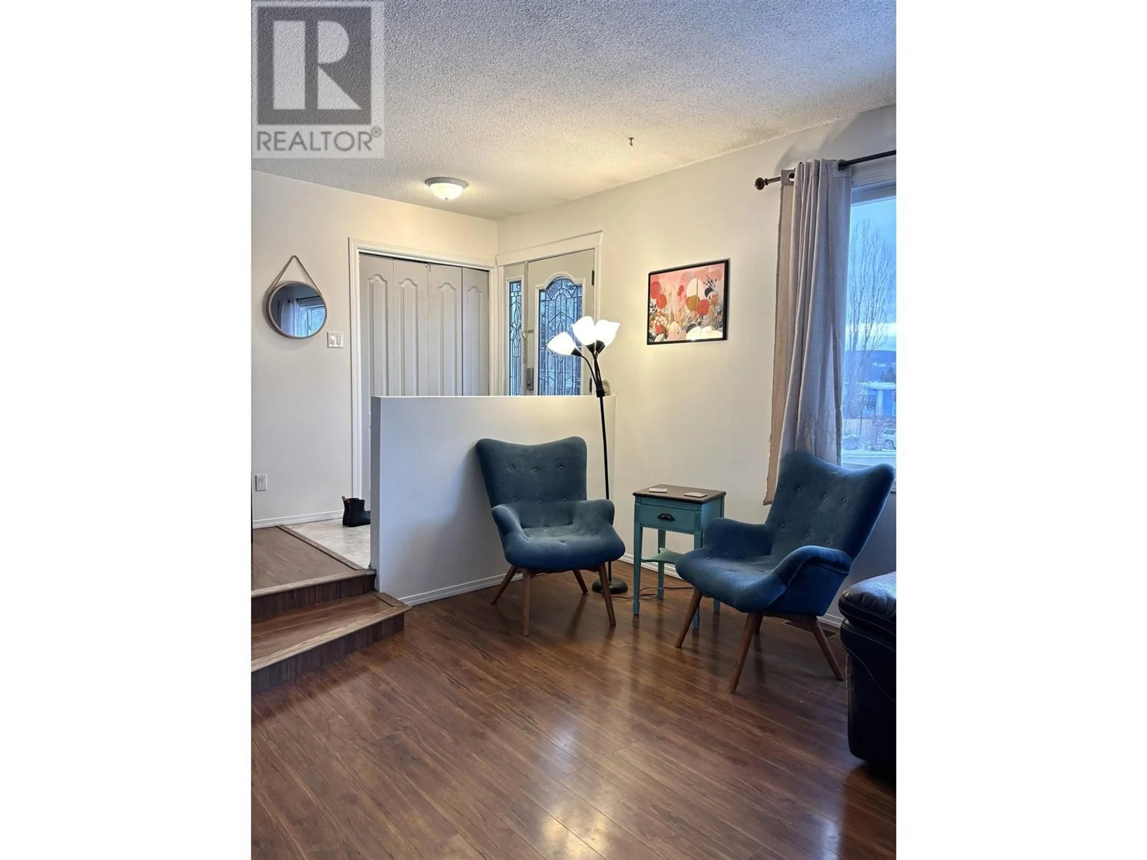 Living room with furniture, wood/laminate floor for 900 BROUGHTON PLACE, Williams Lake British Columbia V2G3Z5