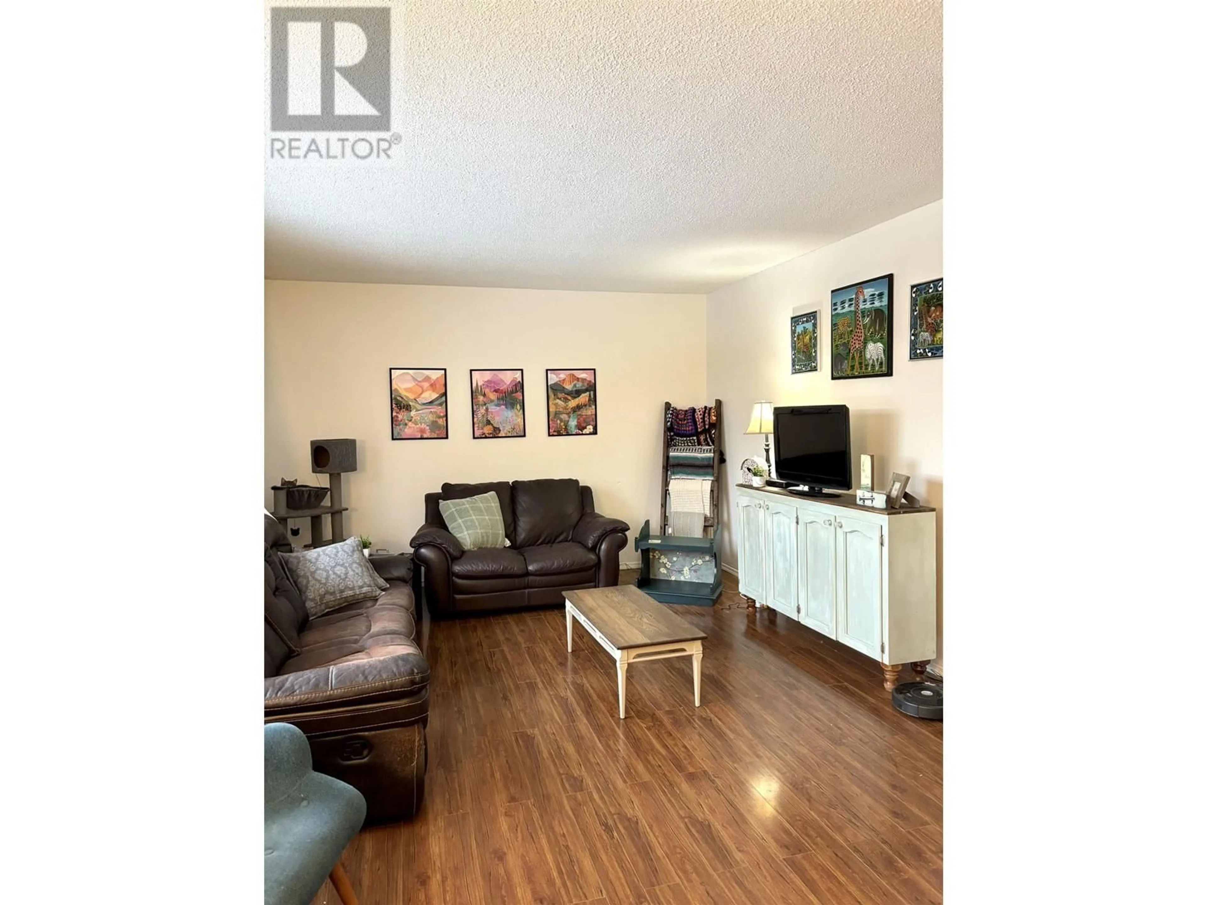 Living room with furniture, wood/laminate floor for 900 BROUGHTON PLACE, Williams Lake British Columbia V2G3Z5