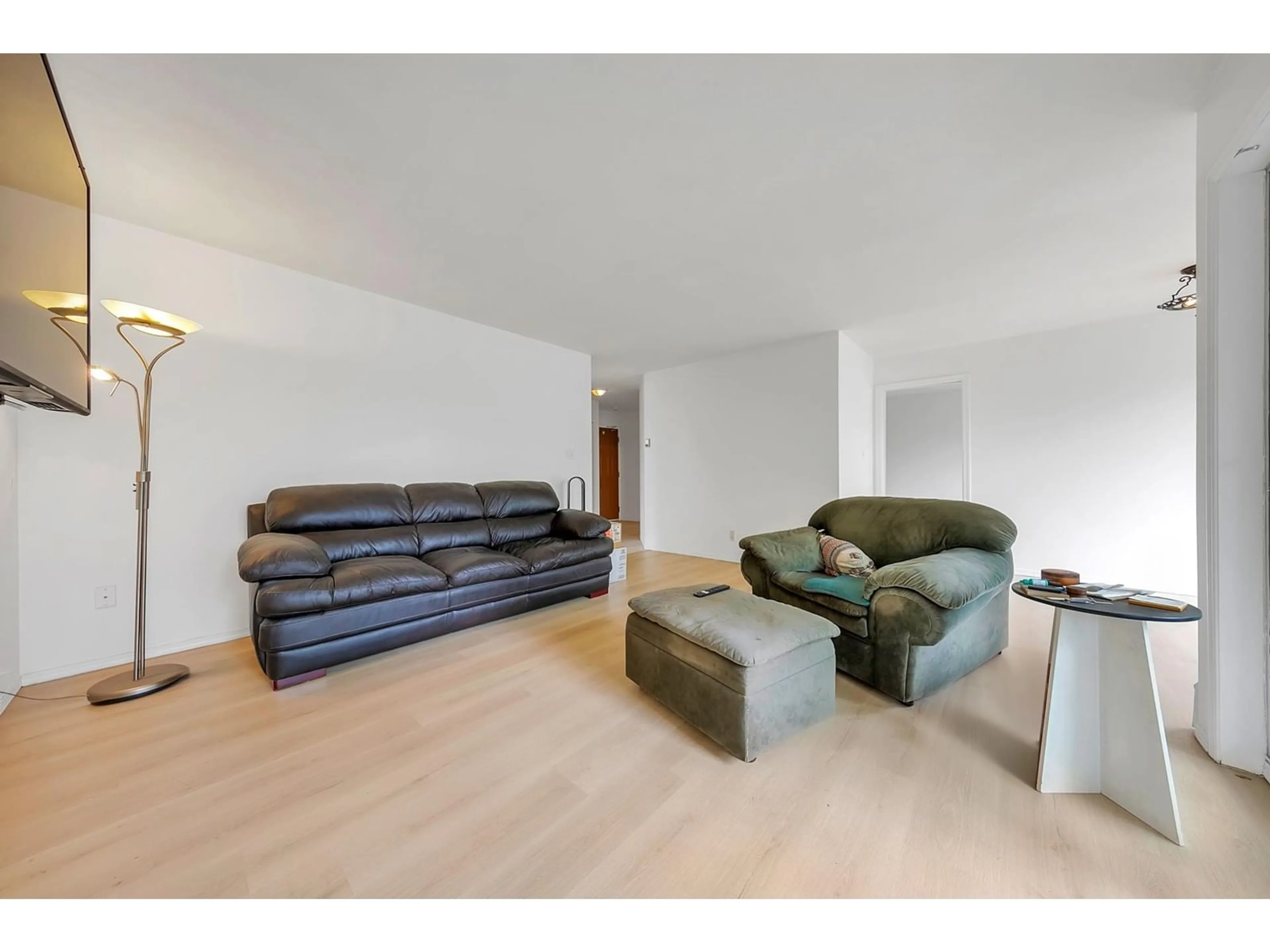 Living room with furniture, wood/laminate floor for 205 32823 LANDEAU PLACE, Abbotsford British Columbia V2S6S6