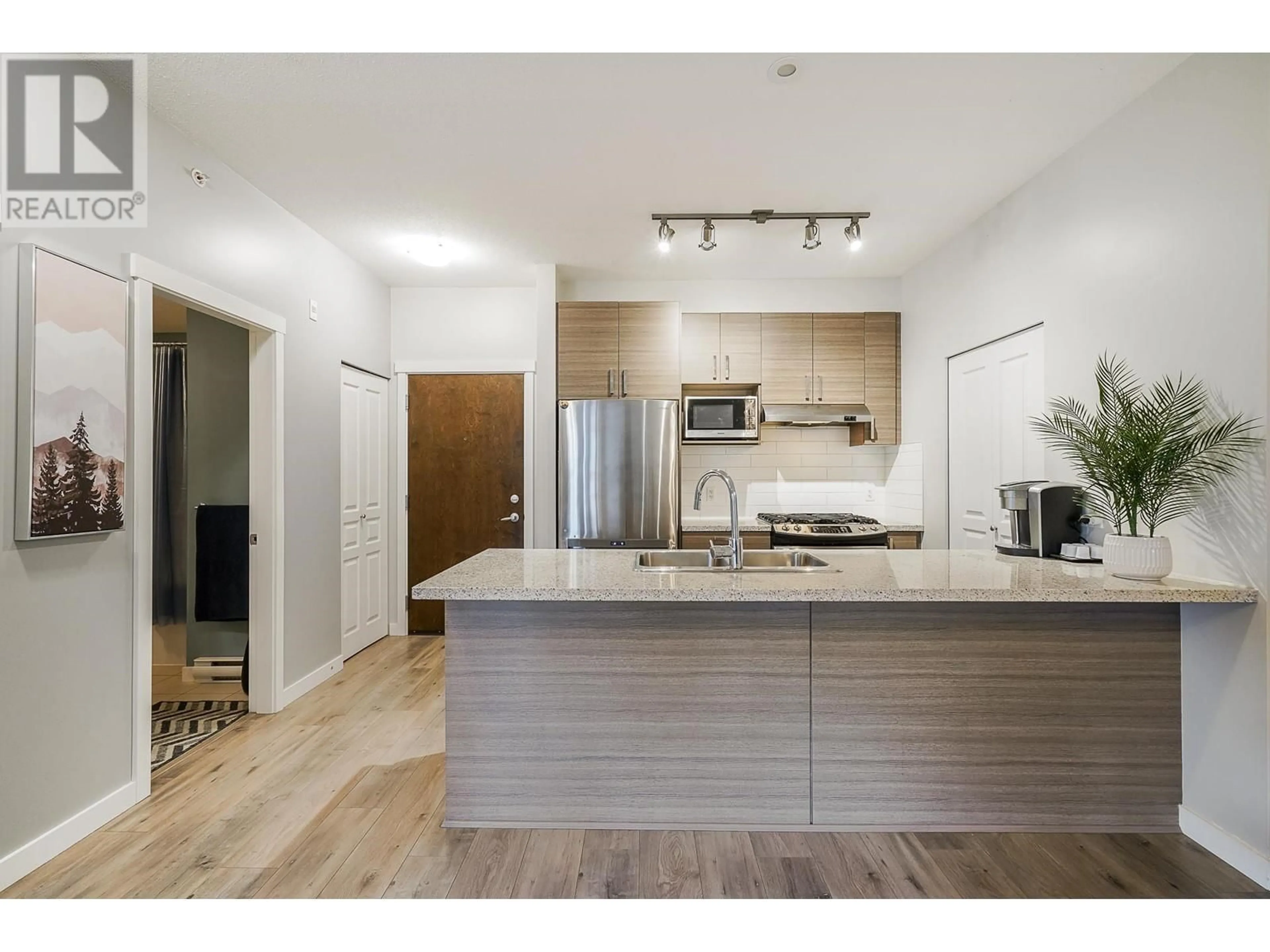 Open concept kitchen, wood/laminate floor for 418 1150 KENSAL PLACE, Coquitlam British Columbia V3B0H4