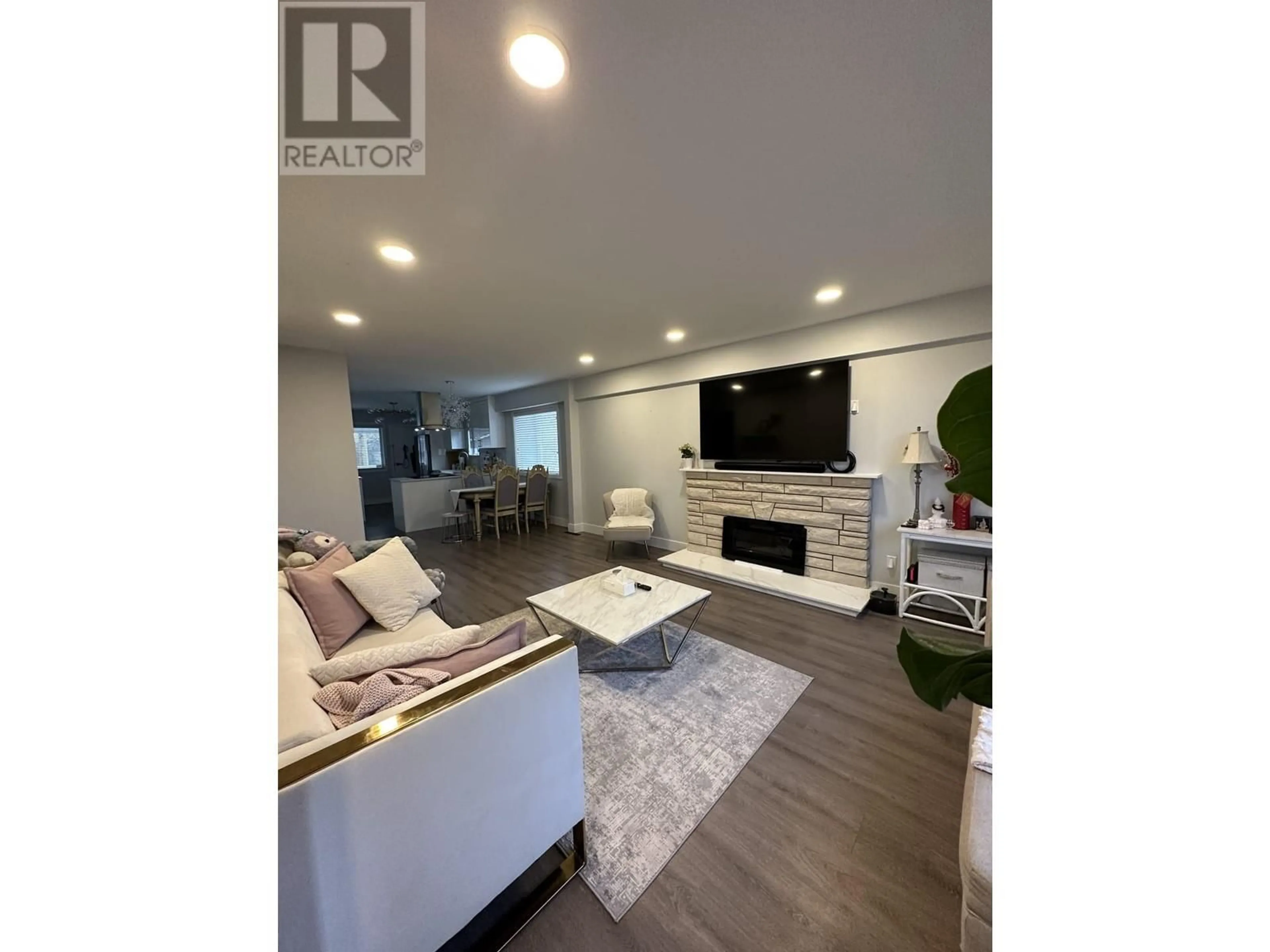 Living room with furniture, wood/laminate floor for 2408 E 54TH AVENUE, Vancouver British Columbia V5S1X3