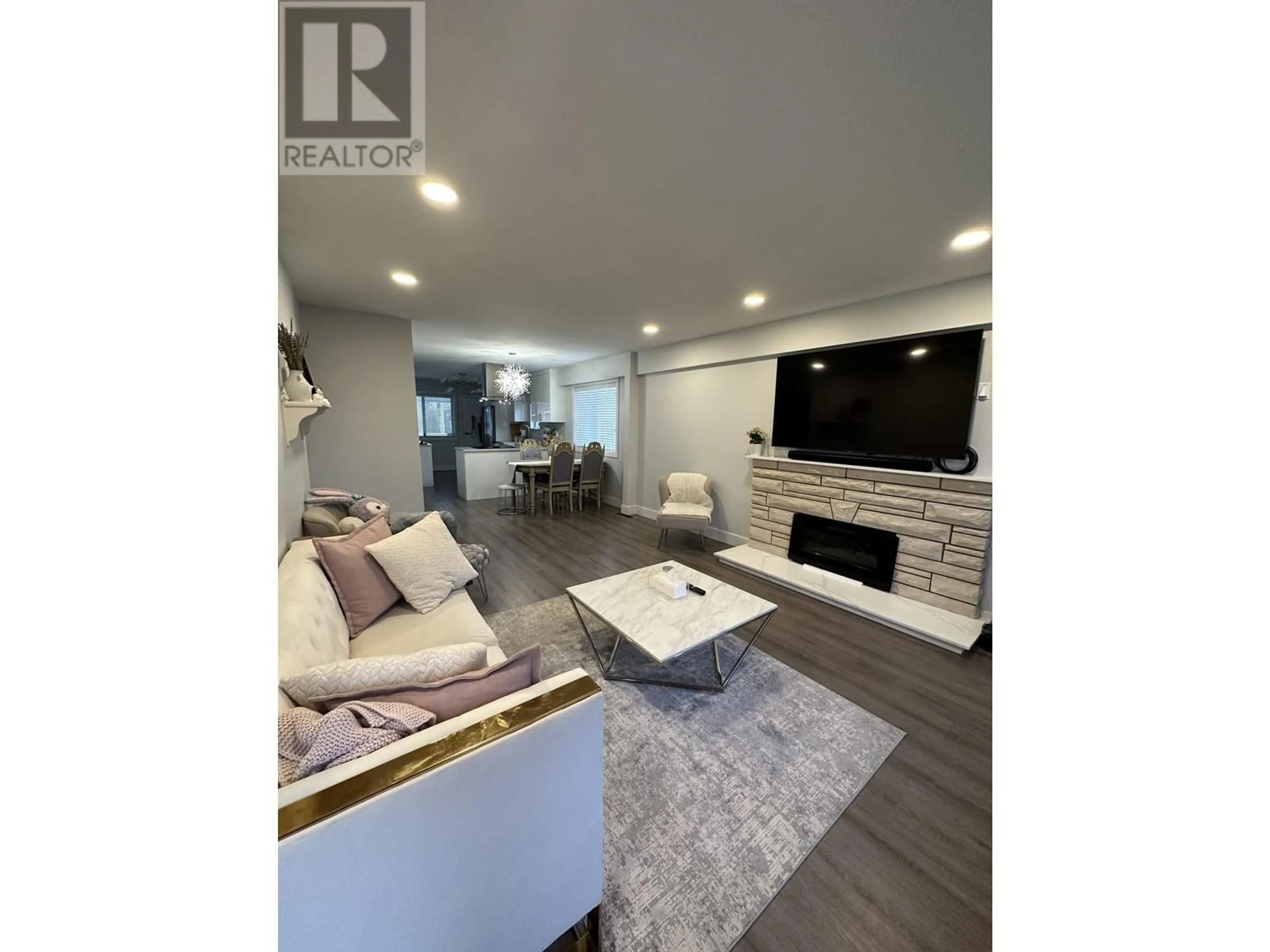 Living room with furniture, wood/laminate floor for 2408 E 54TH AVENUE, Vancouver British Columbia V5S1X3