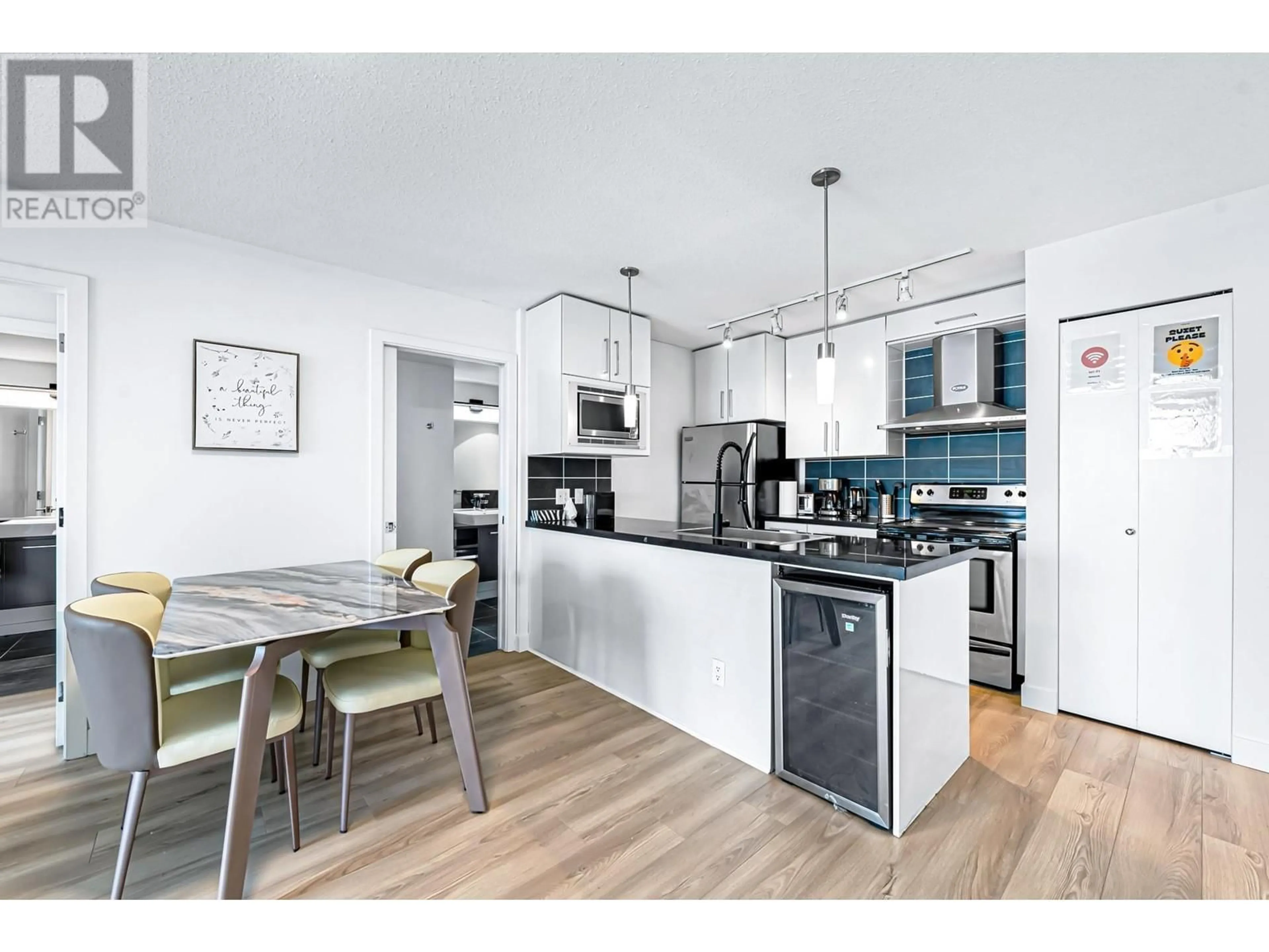 Open concept kitchen, wood/laminate floor for 3103 689 ABBOTT STREET, Vancouver British Columbia V6B0J2