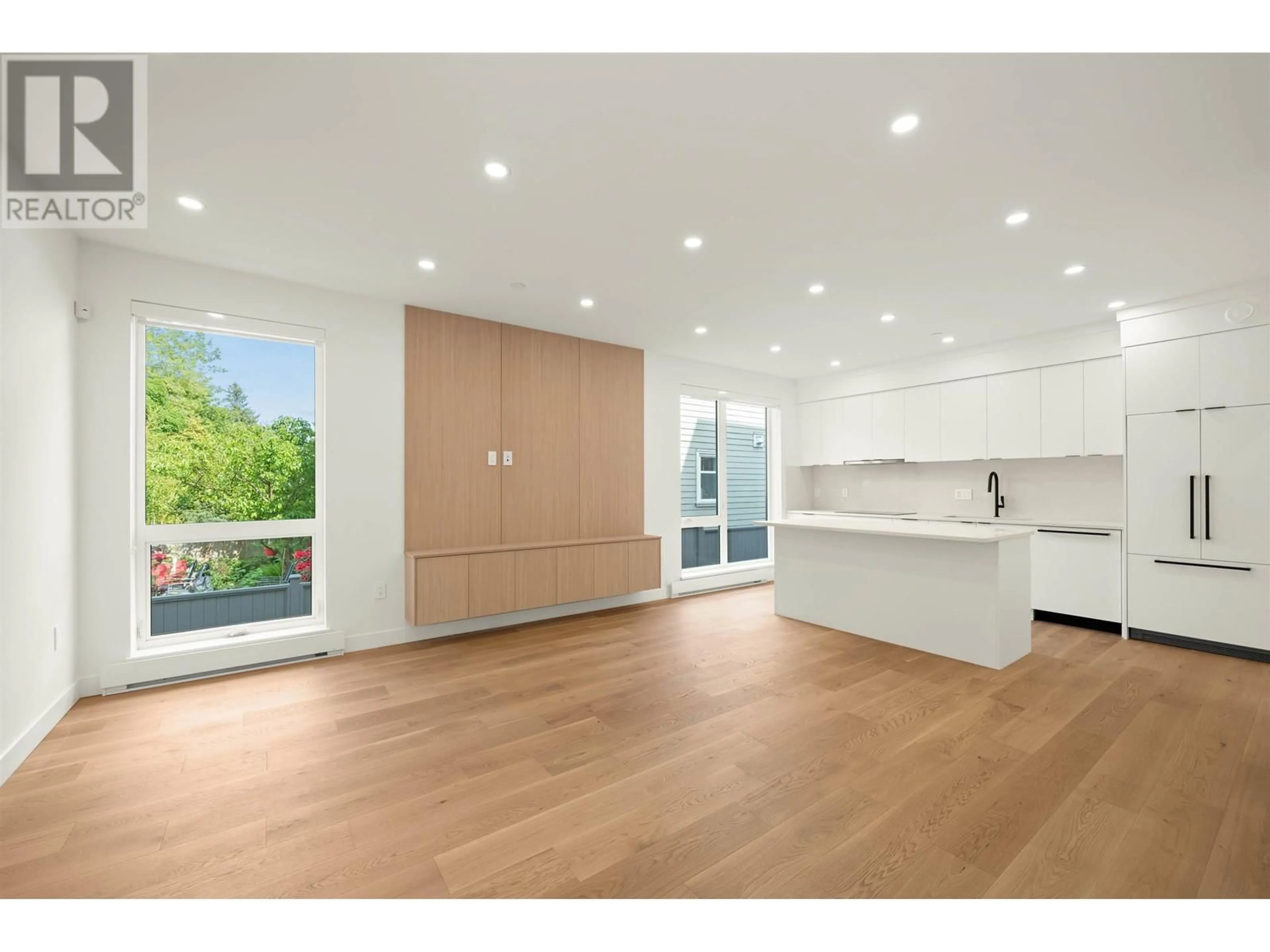 Open concept kitchen, wood/laminate floor for 1904 8TH AVENUE, Vancouver British Columbia V5N1T8