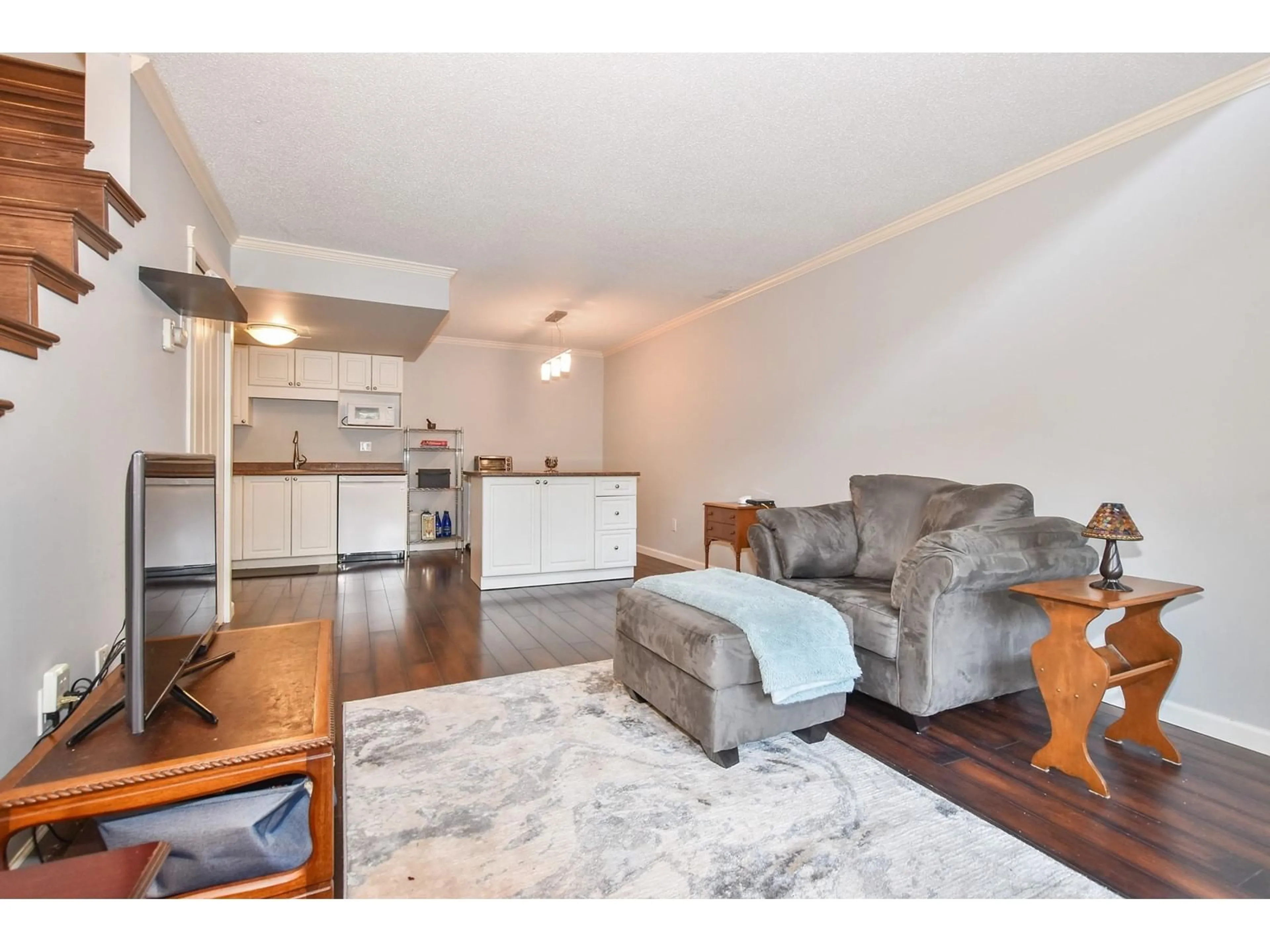 Living room with furniture, wood/laminate floor for 1220 34909 OLD YALE ROAD, Abbotsford British Columbia V3G2E7