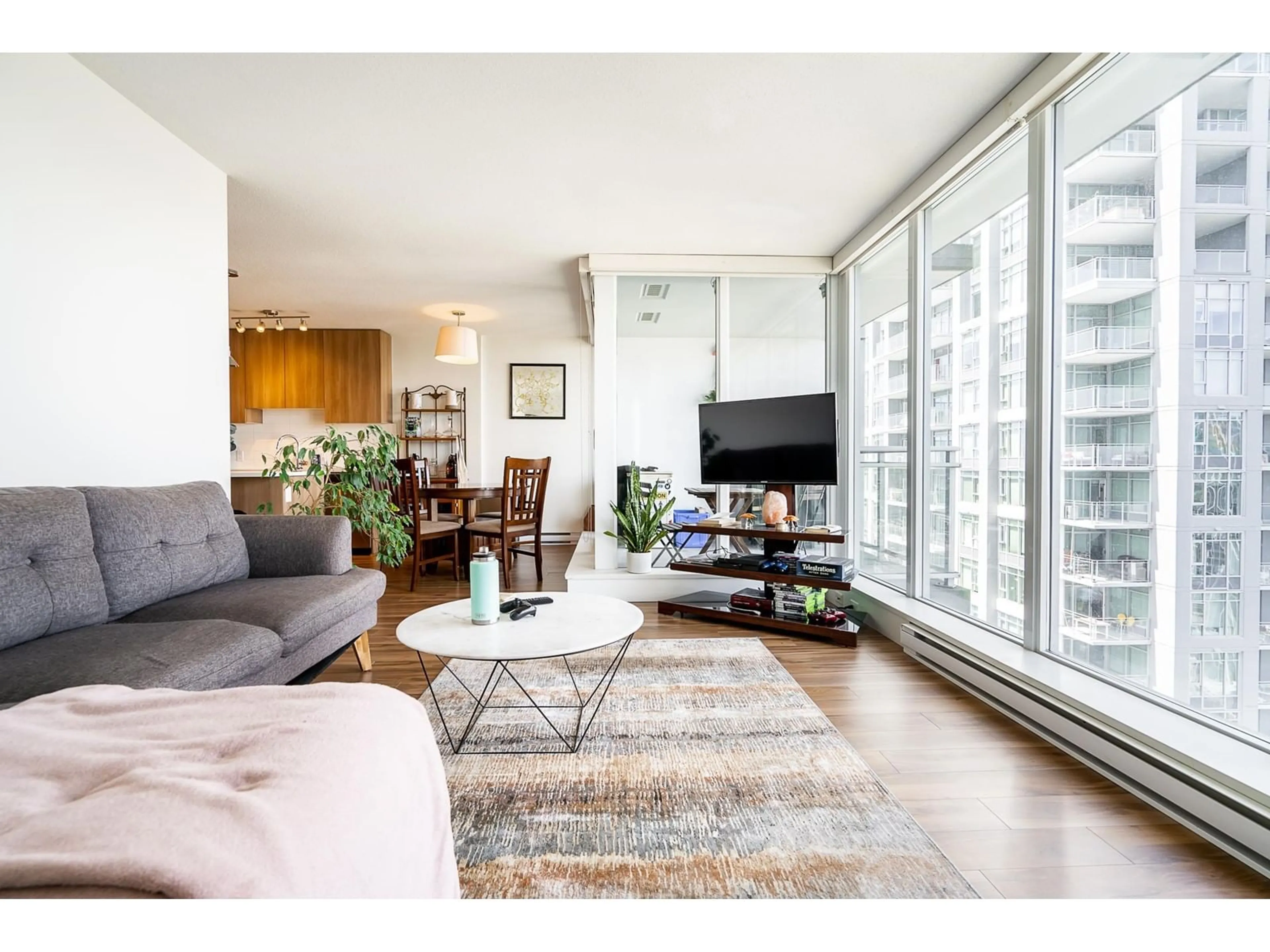 Living room with furniture, wood/laminate floor for 3603 13325 102A AVENUE, Surrey British Columbia V3T0J5