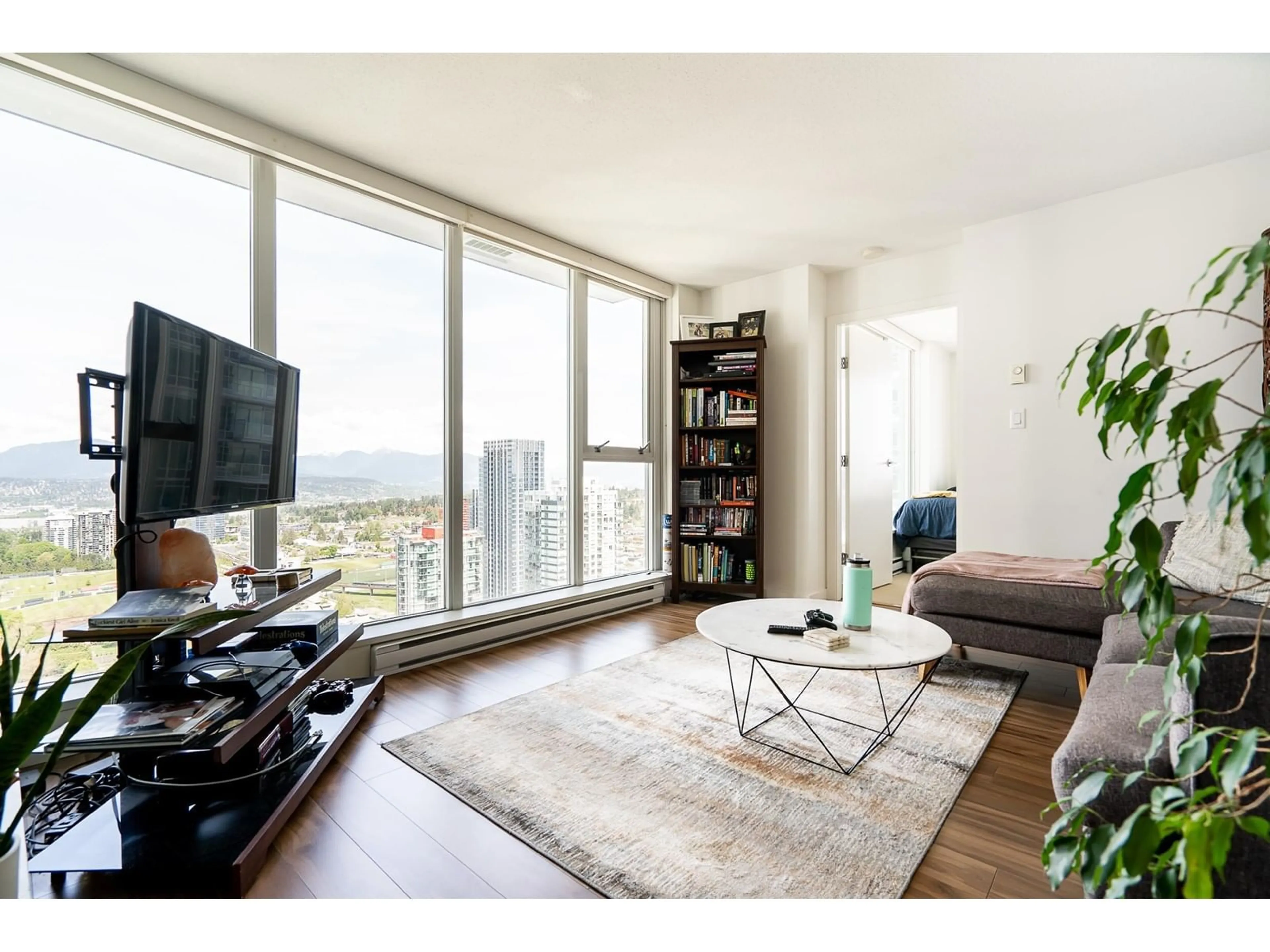 Living room with furniture, wood/laminate floor for 3603 13325 102A AVENUE, Surrey British Columbia V3T0J5