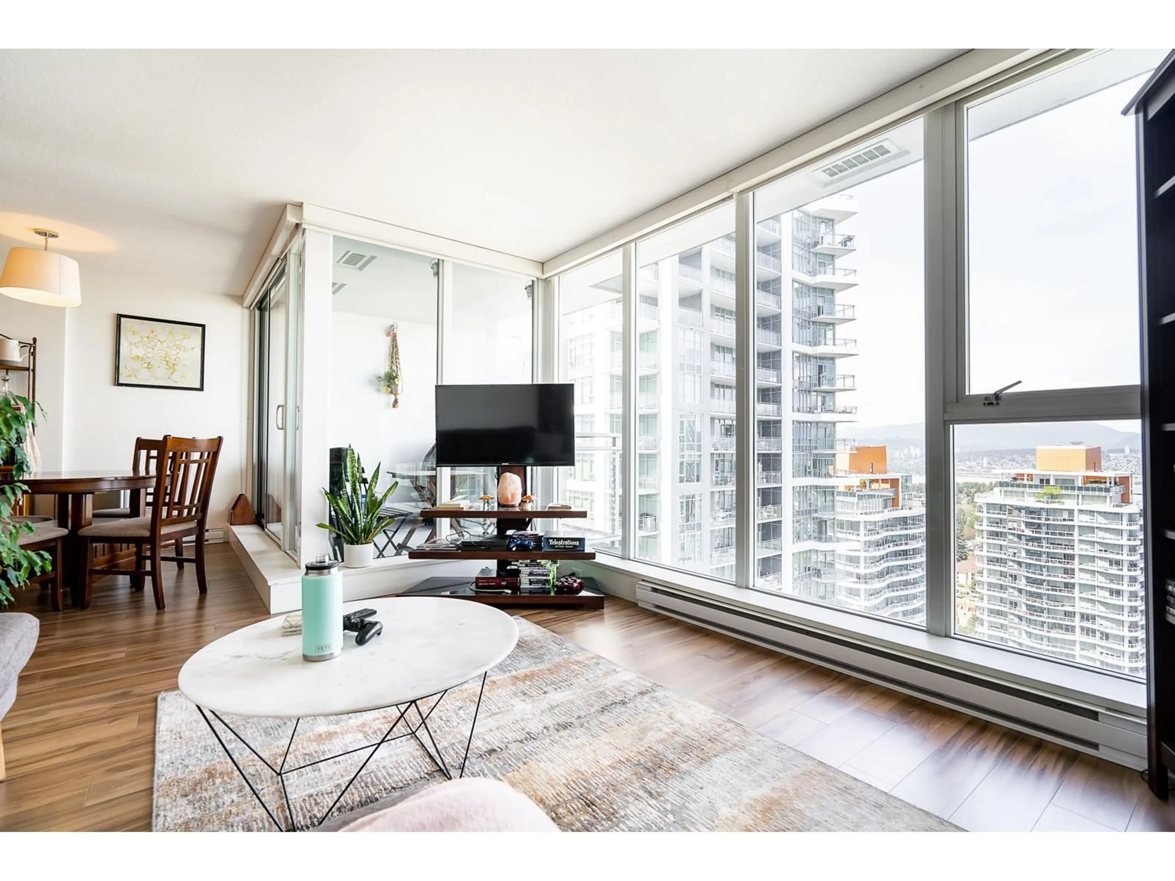 Living room with furniture, wood/laminate floor for 3603 13325 102A AVENUE, Surrey British Columbia V3T0J5