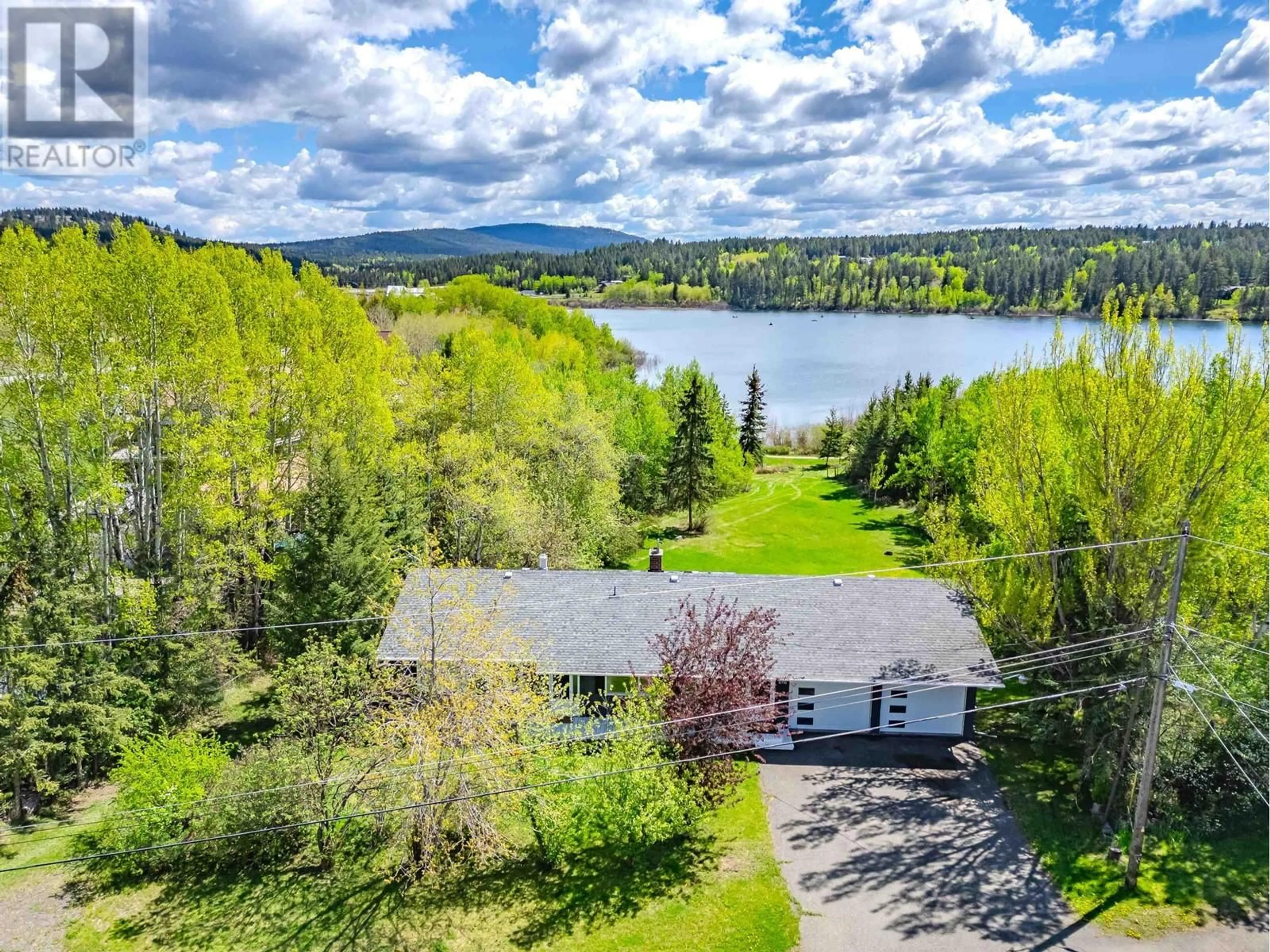 A pic from outside/outdoor area/front of a property/back of a property/a pic from drone, water/lake/river/ocean view for 4715 PARKER COURT, 108 Mile Ranch British Columbia V0K2Z0