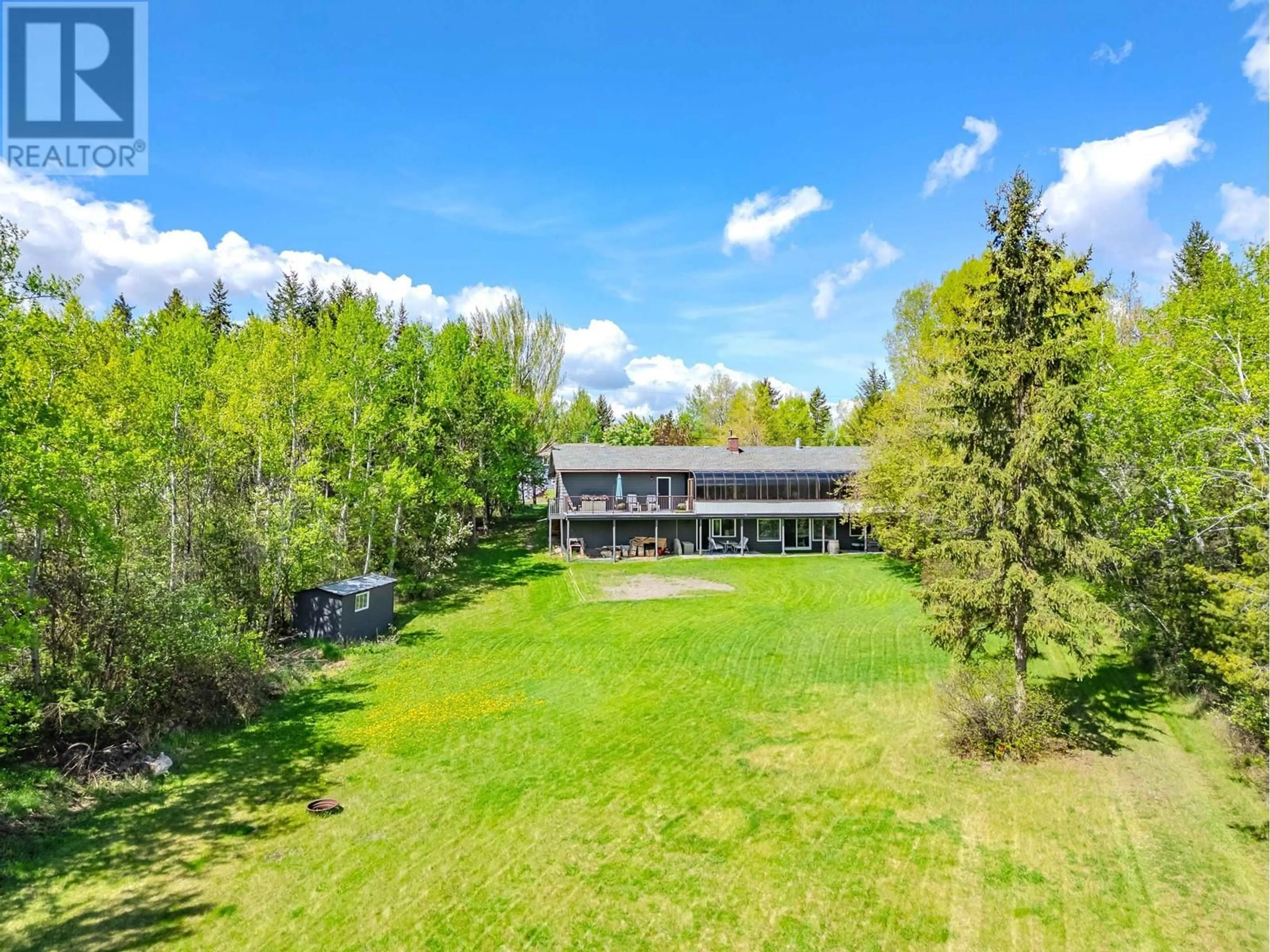 A pic from outside/outdoor area/front of a property/back of a property/a pic from drone, unknown for 4715 PARKER COURT, 108 Mile Ranch British Columbia V0K2Z0