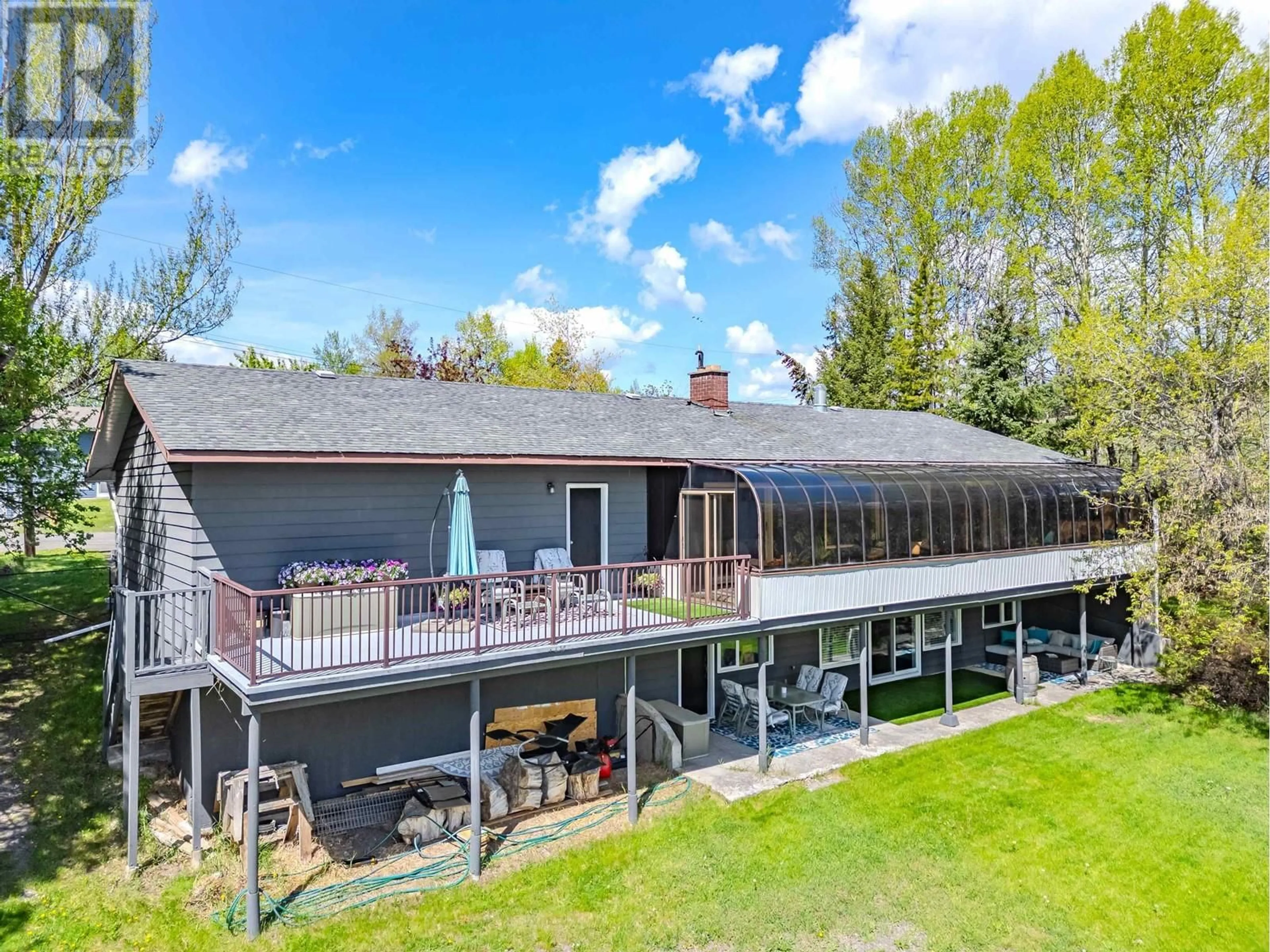 A pic from outside/outdoor area/front of a property/back of a property/a pic from drone, water/lake/river/ocean view for 4715 PARKER COURT, 108 Mile Ranch British Columbia V0K2Z0