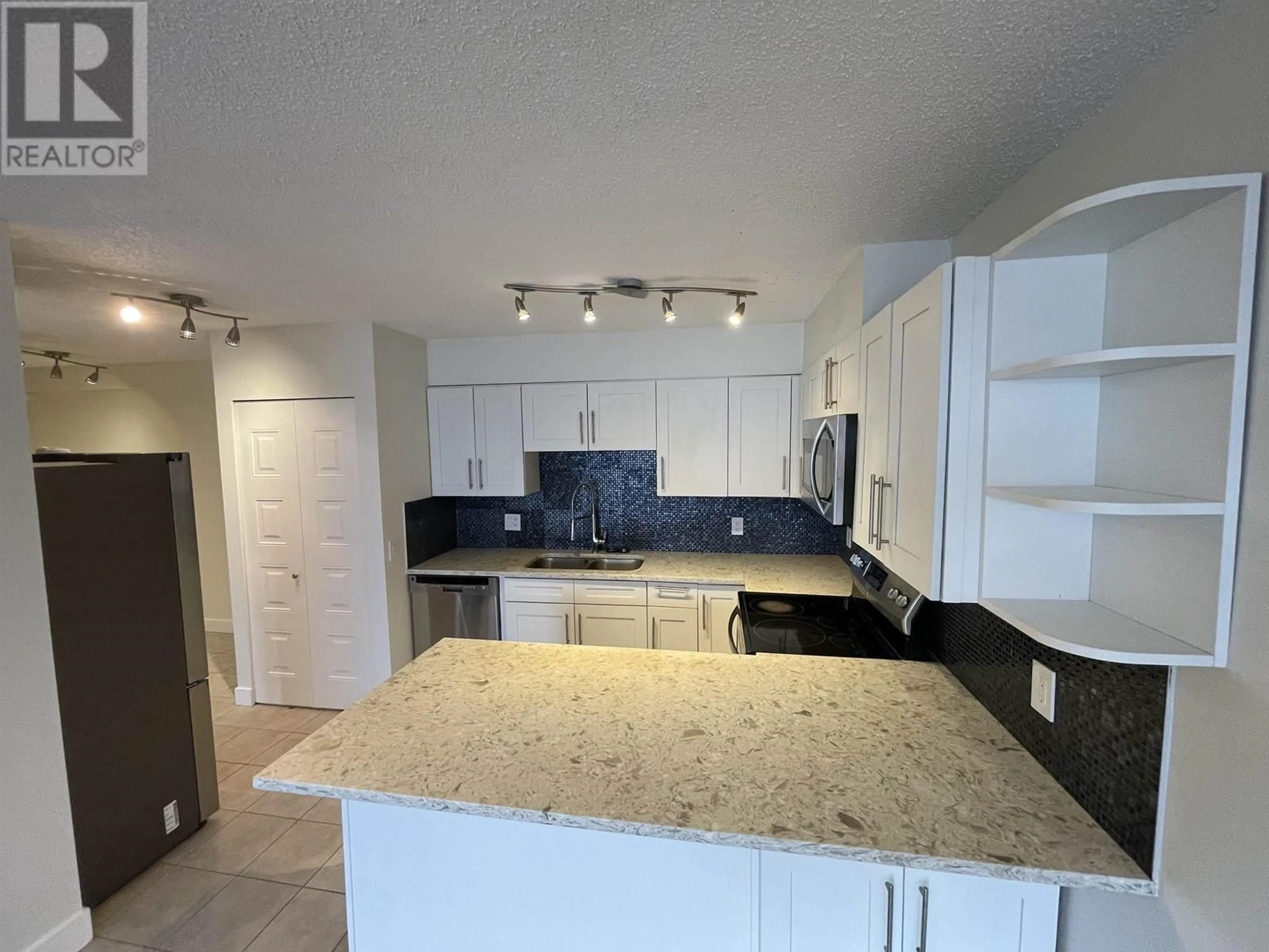 Open concept kitchen, ceramic/tile floor for 1301 3970 CARRIGAN COURT, Burnaby British Columbia V3N4S5