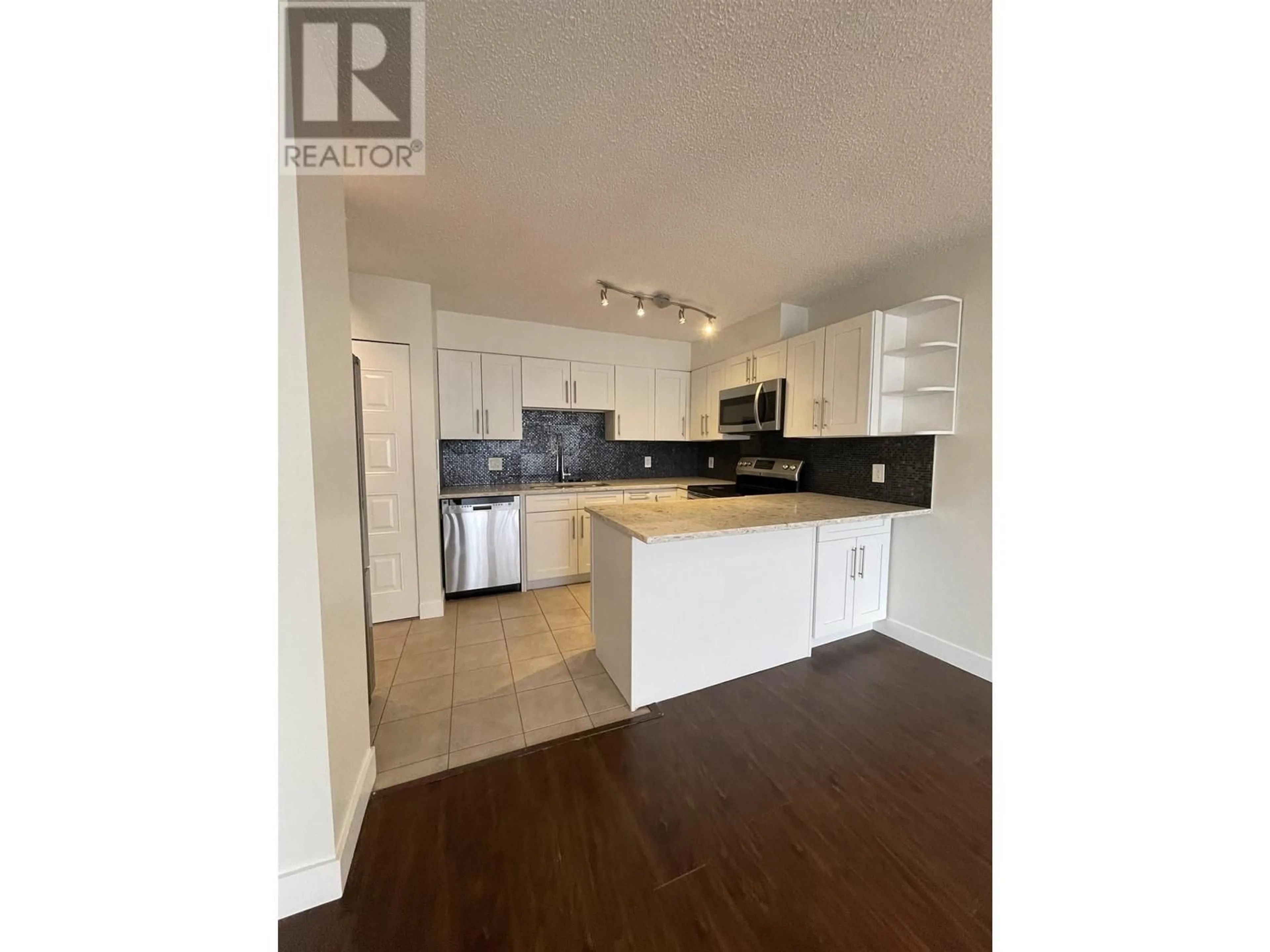 Open concept kitchen, wood/laminate floor for 1301 3970 CARRIGAN COURT, Burnaby British Columbia V3N4S5