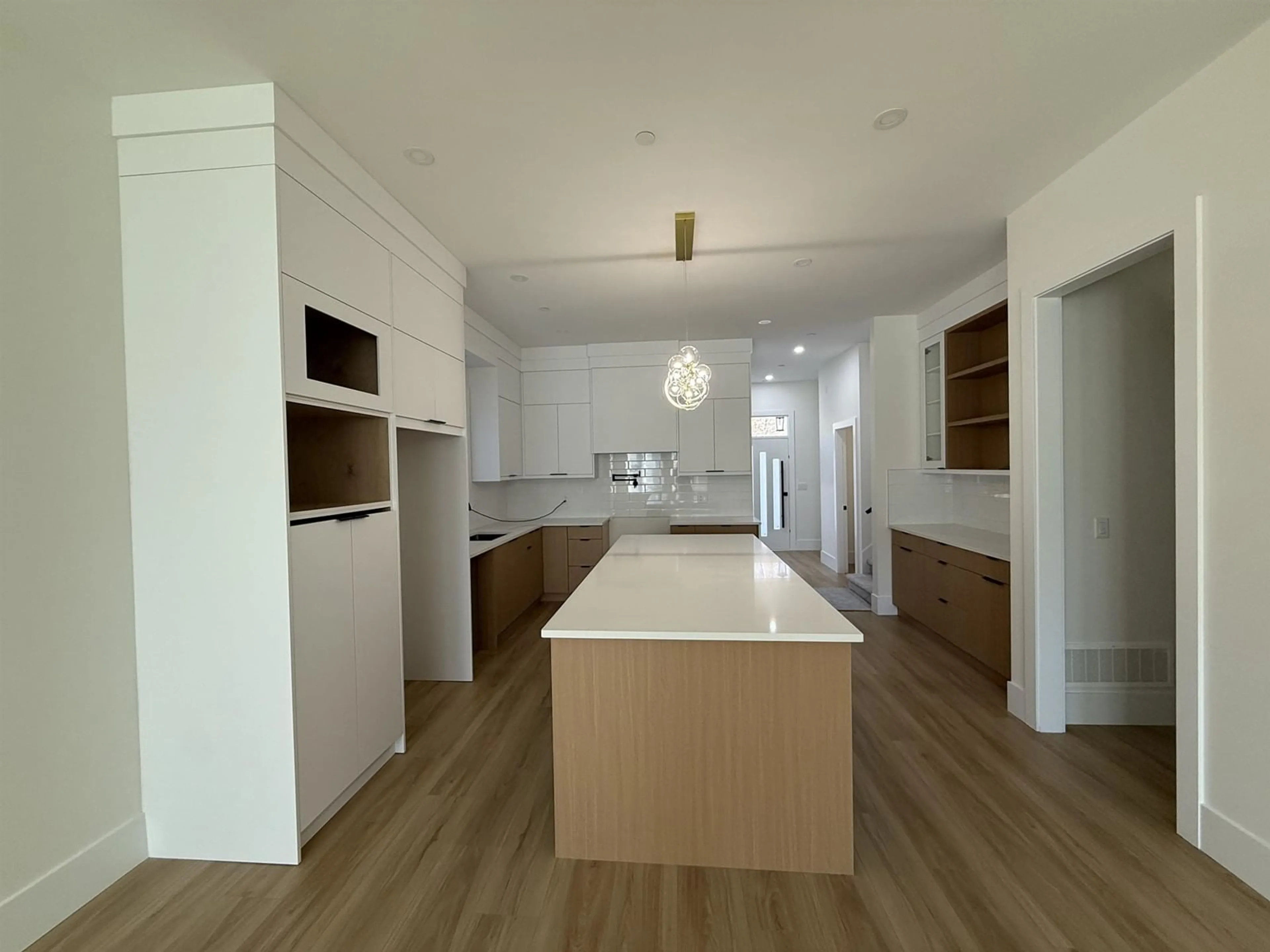 Open concept kitchen, wood/laminate floor for 7751 197 STREET, Surrey British Columbia V2Y3V5