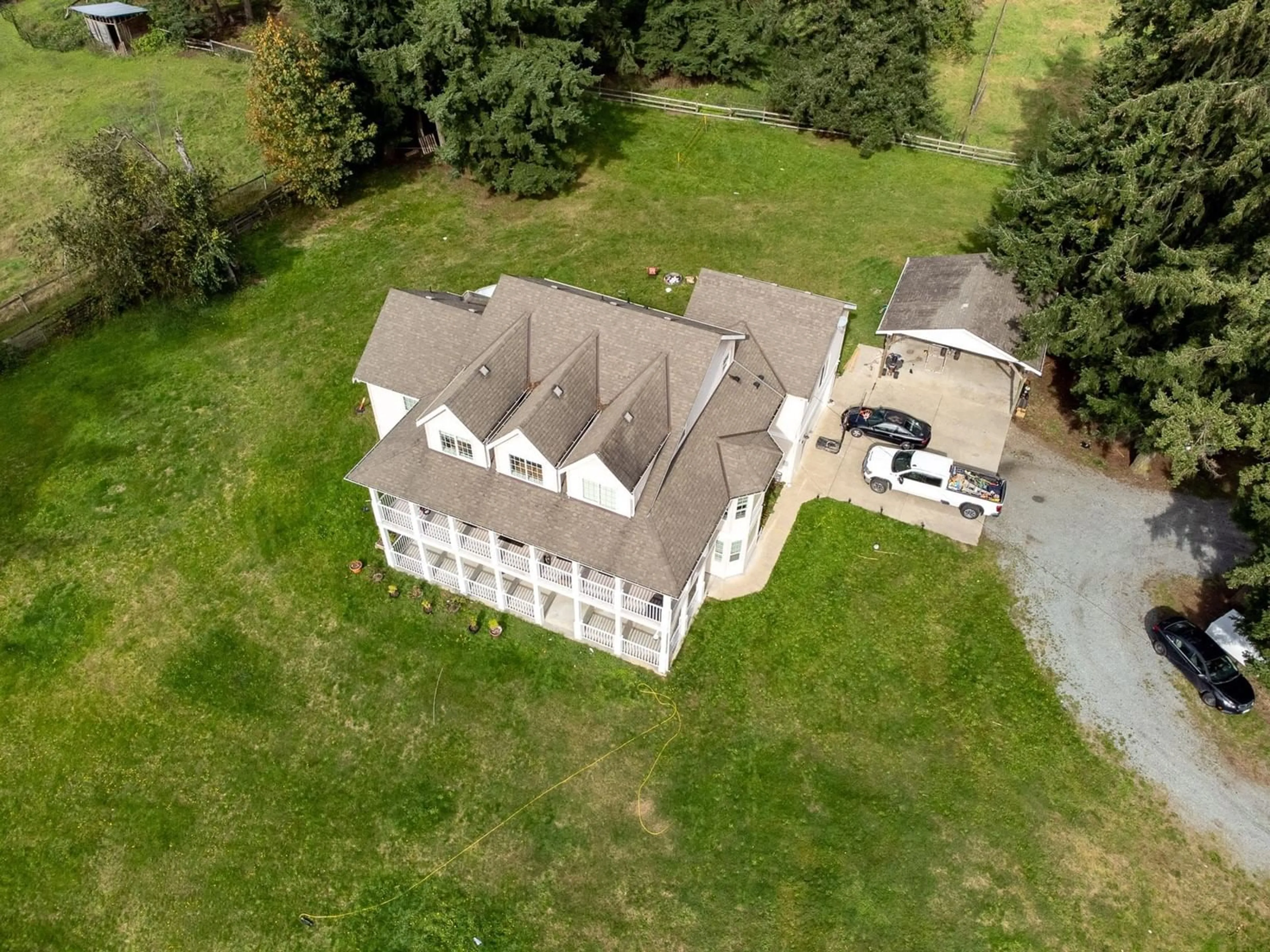 A pic from outside/outdoor area/front of a property/back of a property/a pic from drone, building for 25039 8 AVENUE, Langley British Columbia V4W2G5