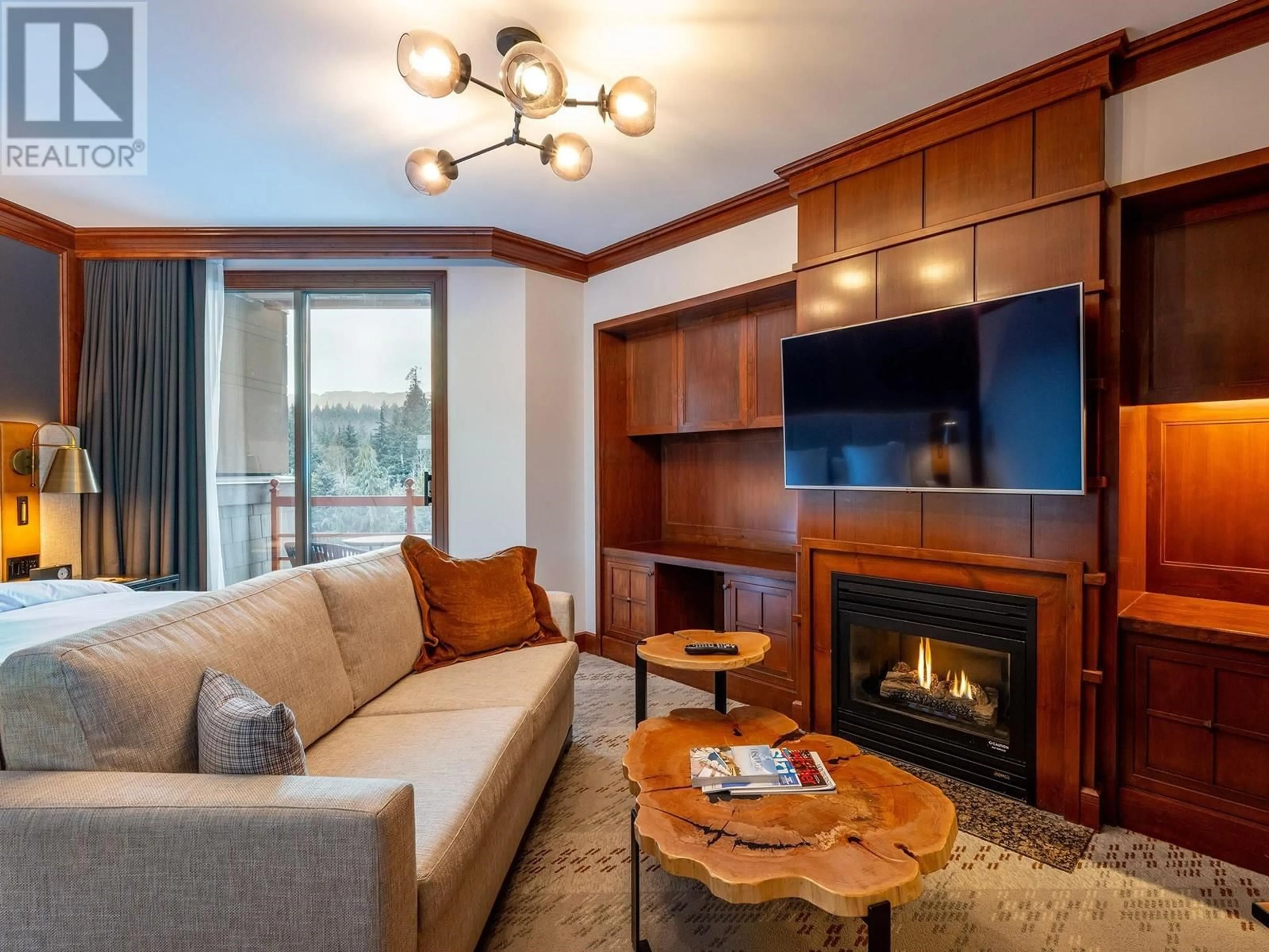 Living room with furniture, wood/laminate floor for 410 4591 BLACKCOMB WAY, Whistler British Columbia V8E0Y4