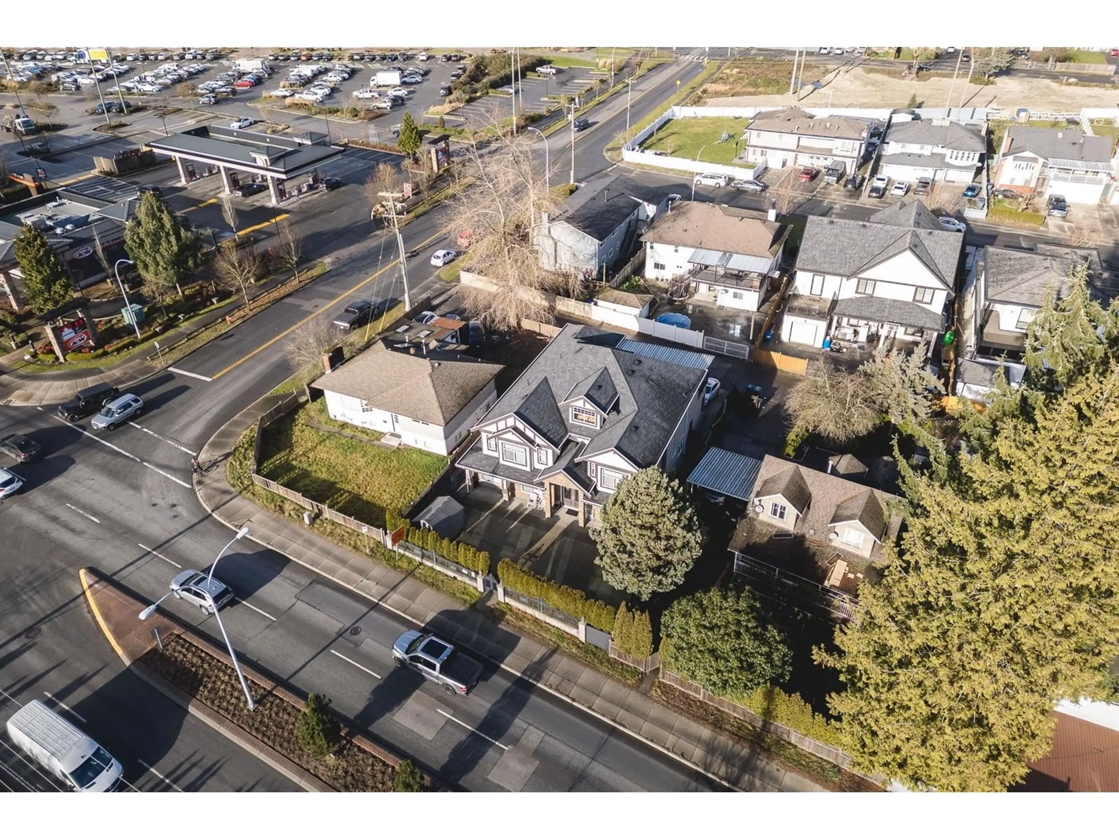 A pic from outside/outdoor area/front of a property/back of a property/a pic from drone, street for 12617 88 AVENUE, Surrey British Columbia V3W3J8