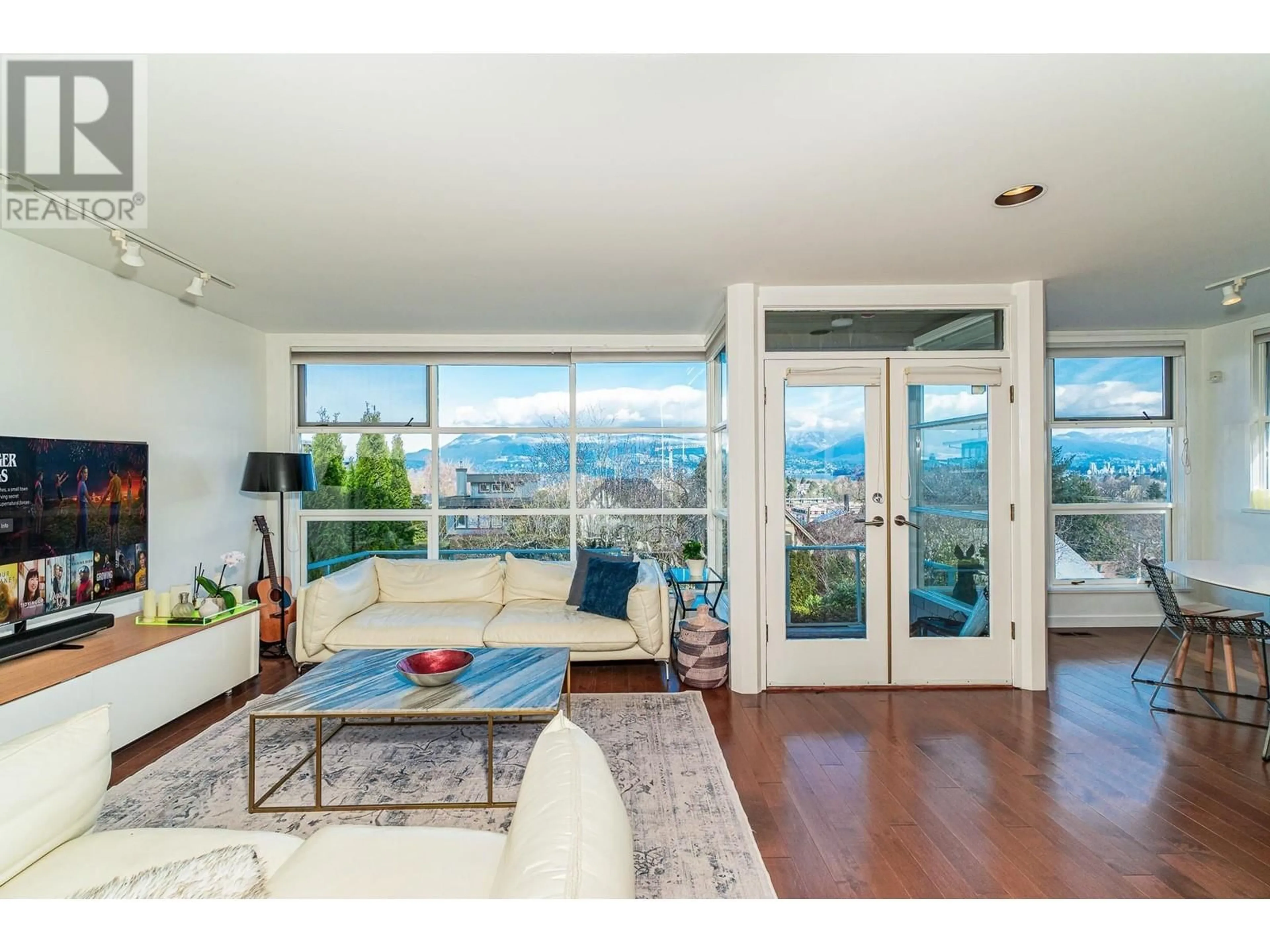 Living room with furniture, wood/laminate floor for 3762 W 13TH AVENUE, Vancouver British Columbia V6R2S6