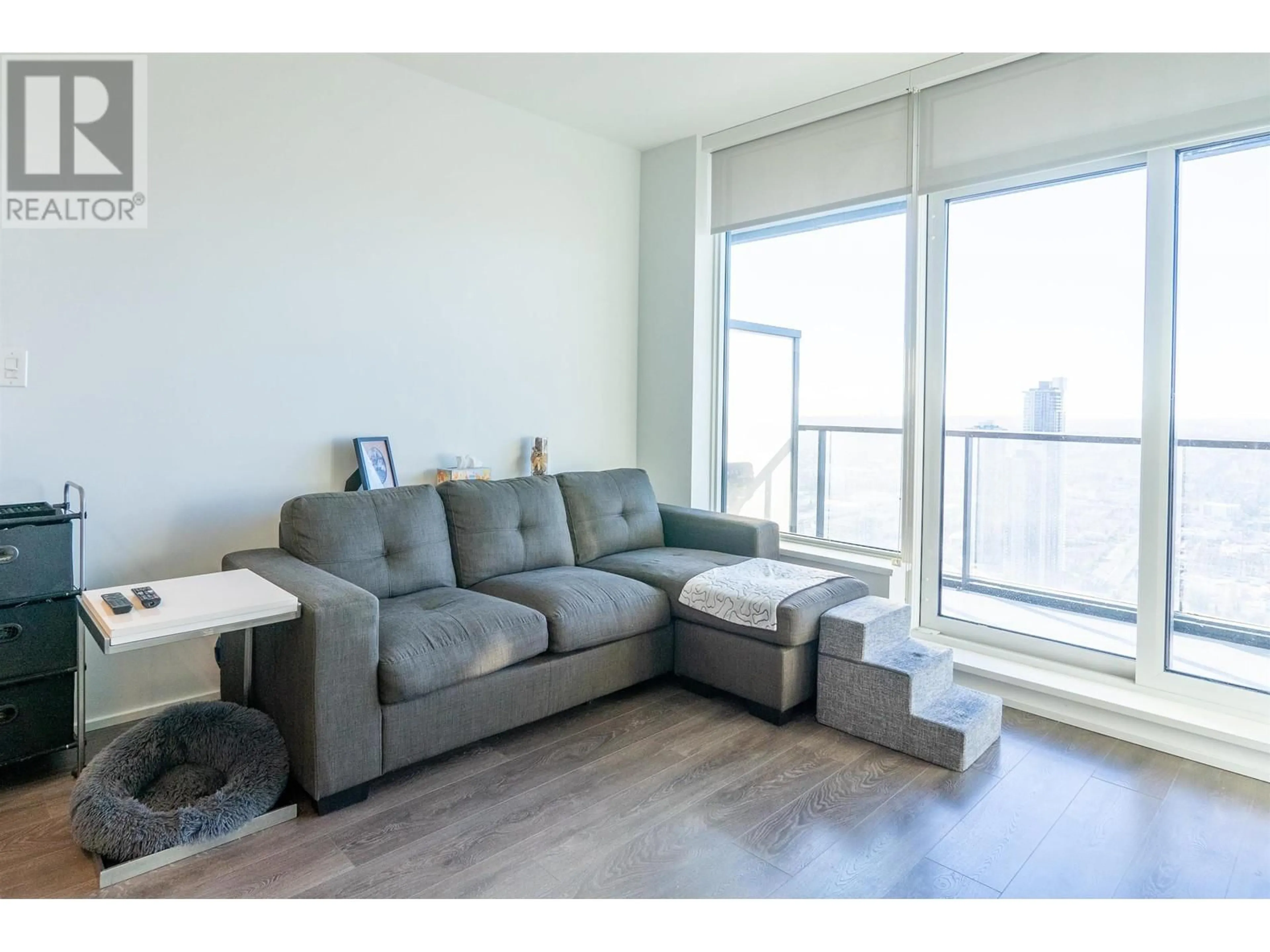 Living room with furniture, wood/laminate floor for 5610 4510 HALIFAX WAY, Burnaby British Columbia V5C0K4