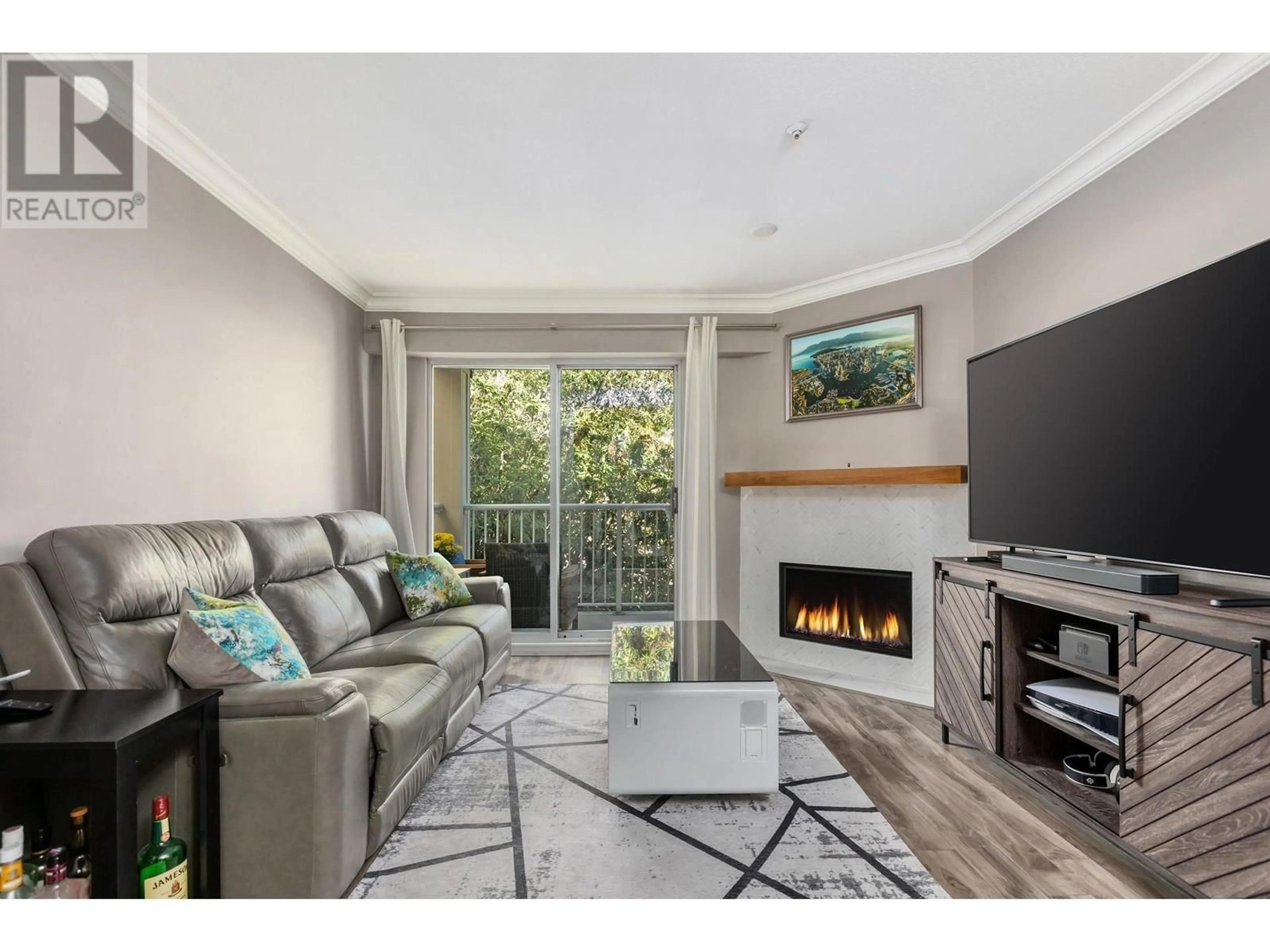 Living room with furniture, wood/laminate floor for 310 1035 AUCKLAND STREET, New Westminster British Columbia V3M1K9