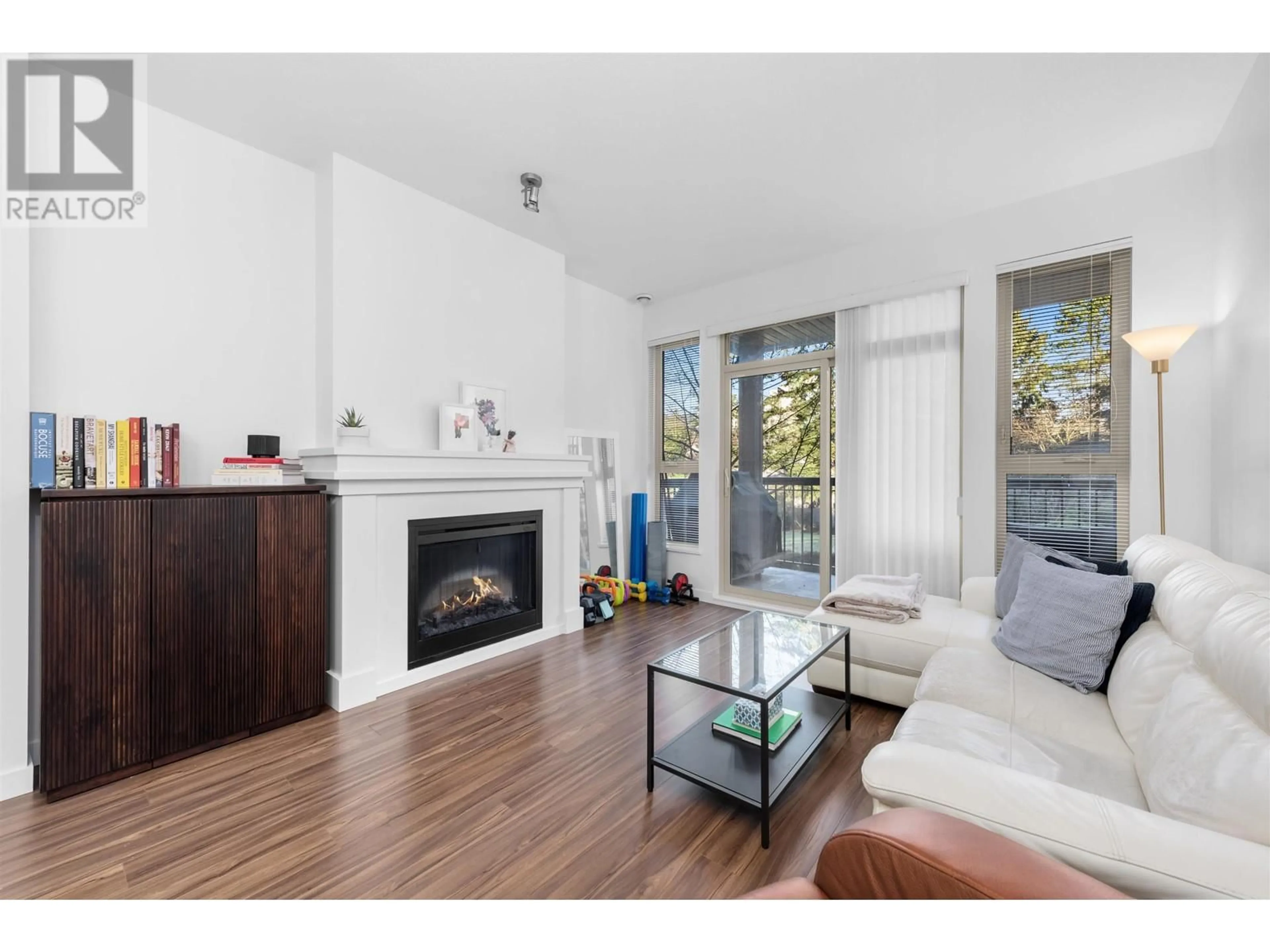 Living room with furniture, wood/laminate floor for 203 1150 KENSAL PLACE, Coquitlam British Columbia V3B0H4