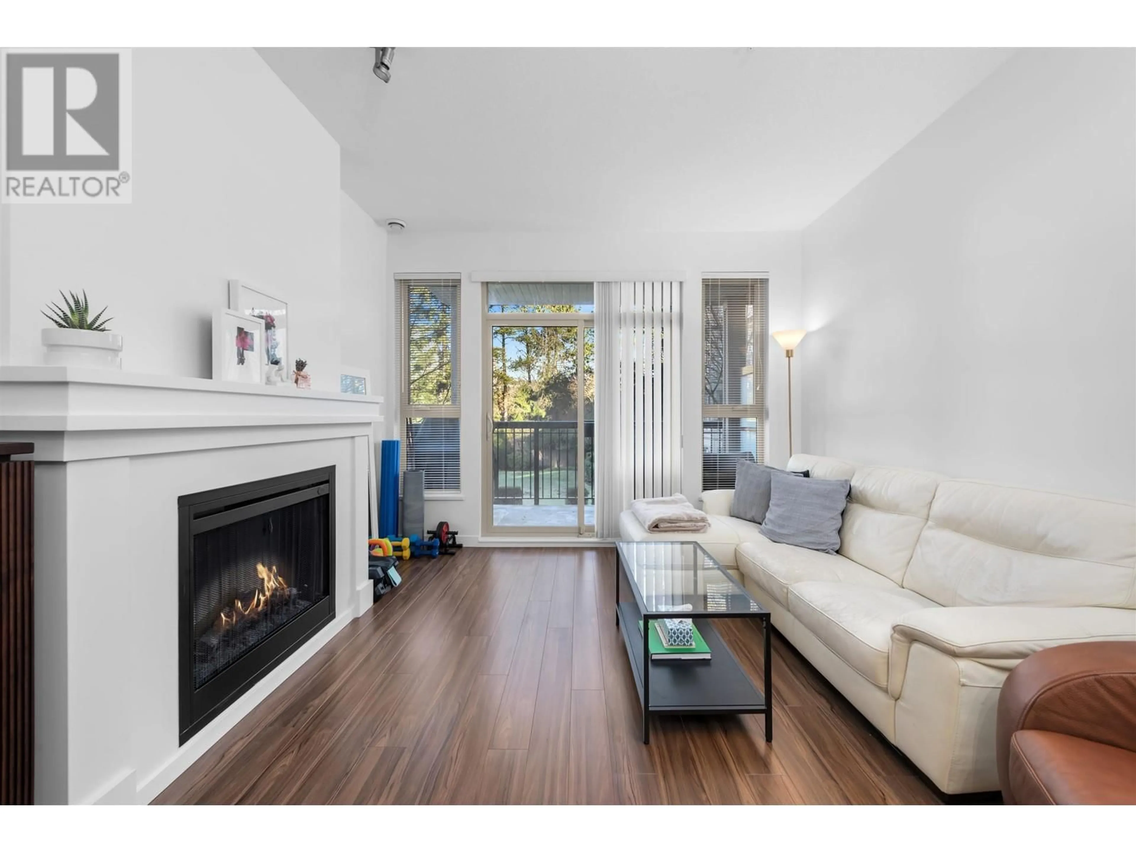 Living room with furniture, wood/laminate floor for 203 1150 KENSAL PLACE, Coquitlam British Columbia V3B0H4