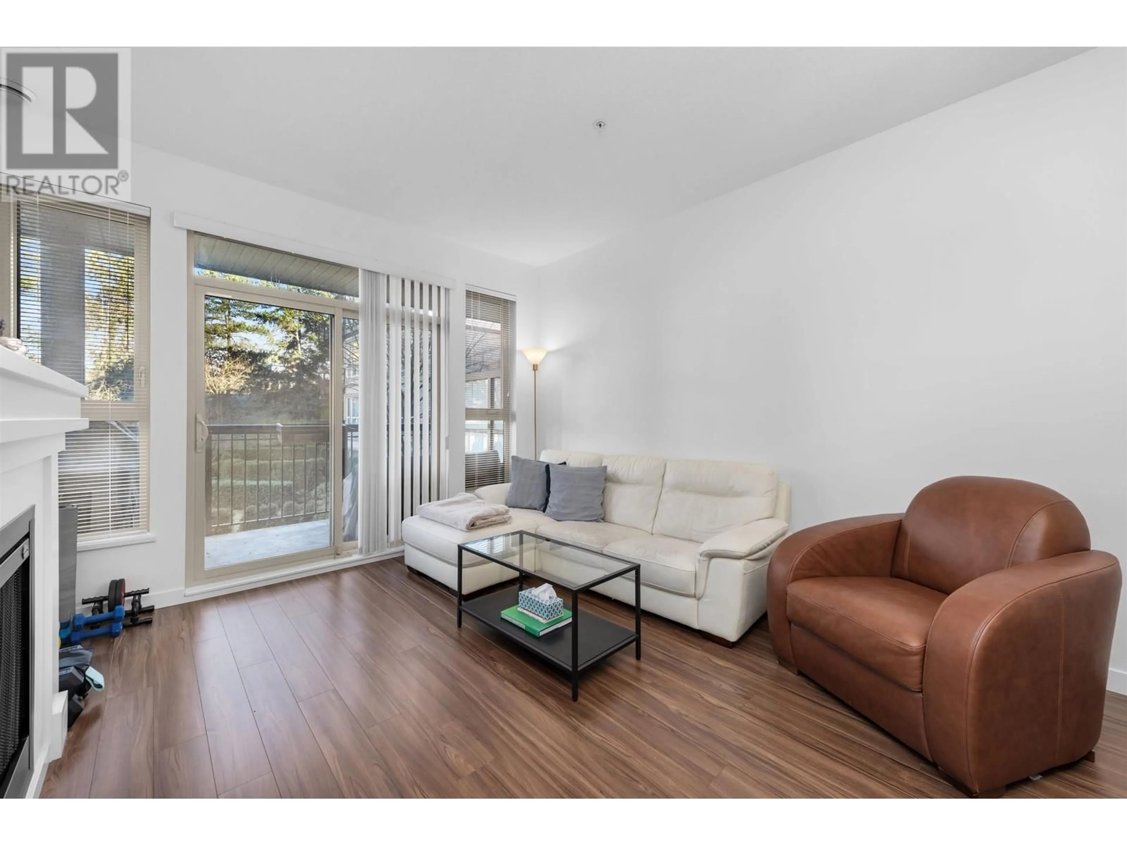 Living room with furniture, wood/laminate floor for 203 1150 KENSAL PLACE, Coquitlam British Columbia V3B0H4