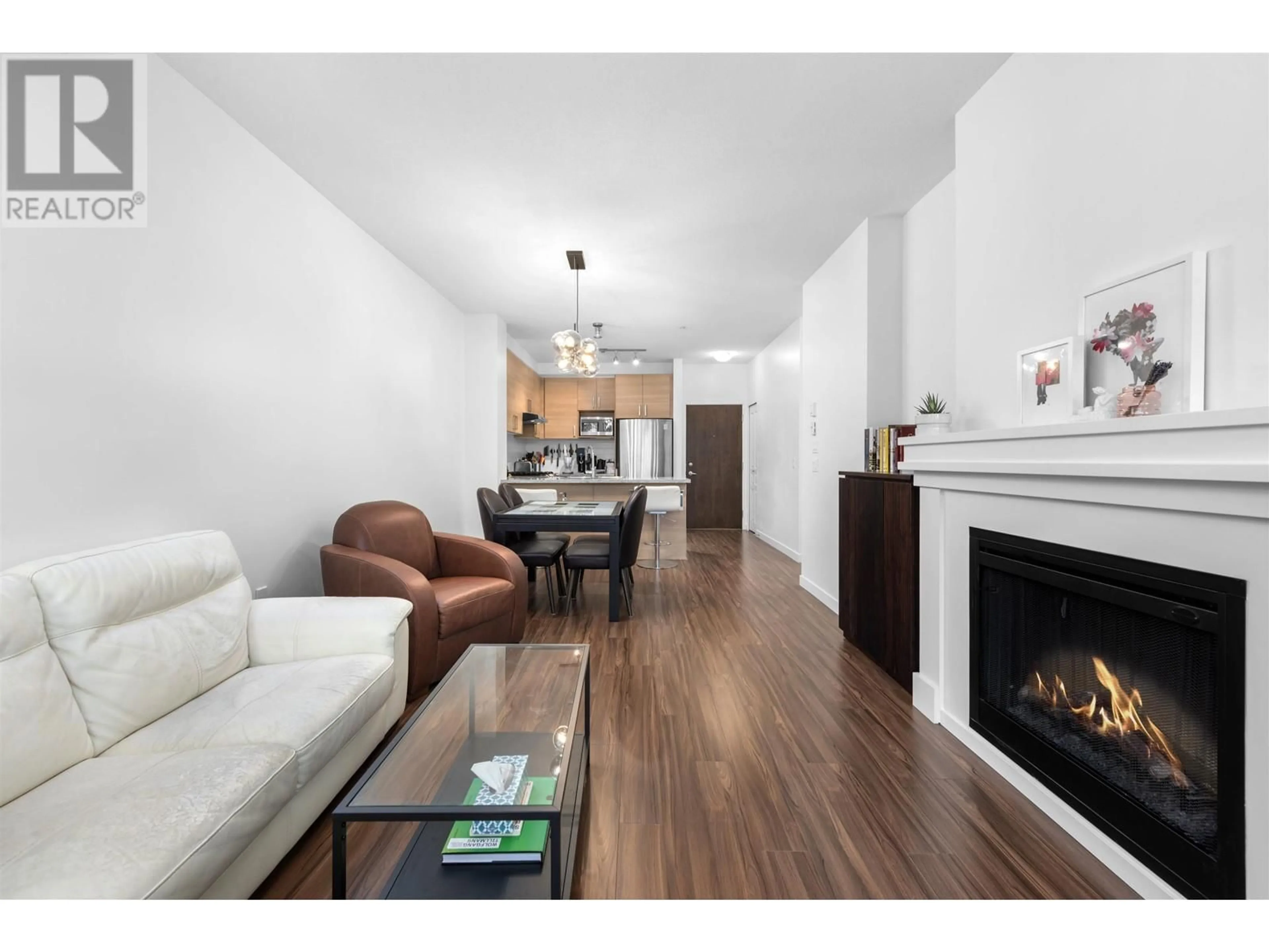 Living room with furniture, wood/laminate floor for 203 1150 KENSAL PLACE, Coquitlam British Columbia V3B0H4