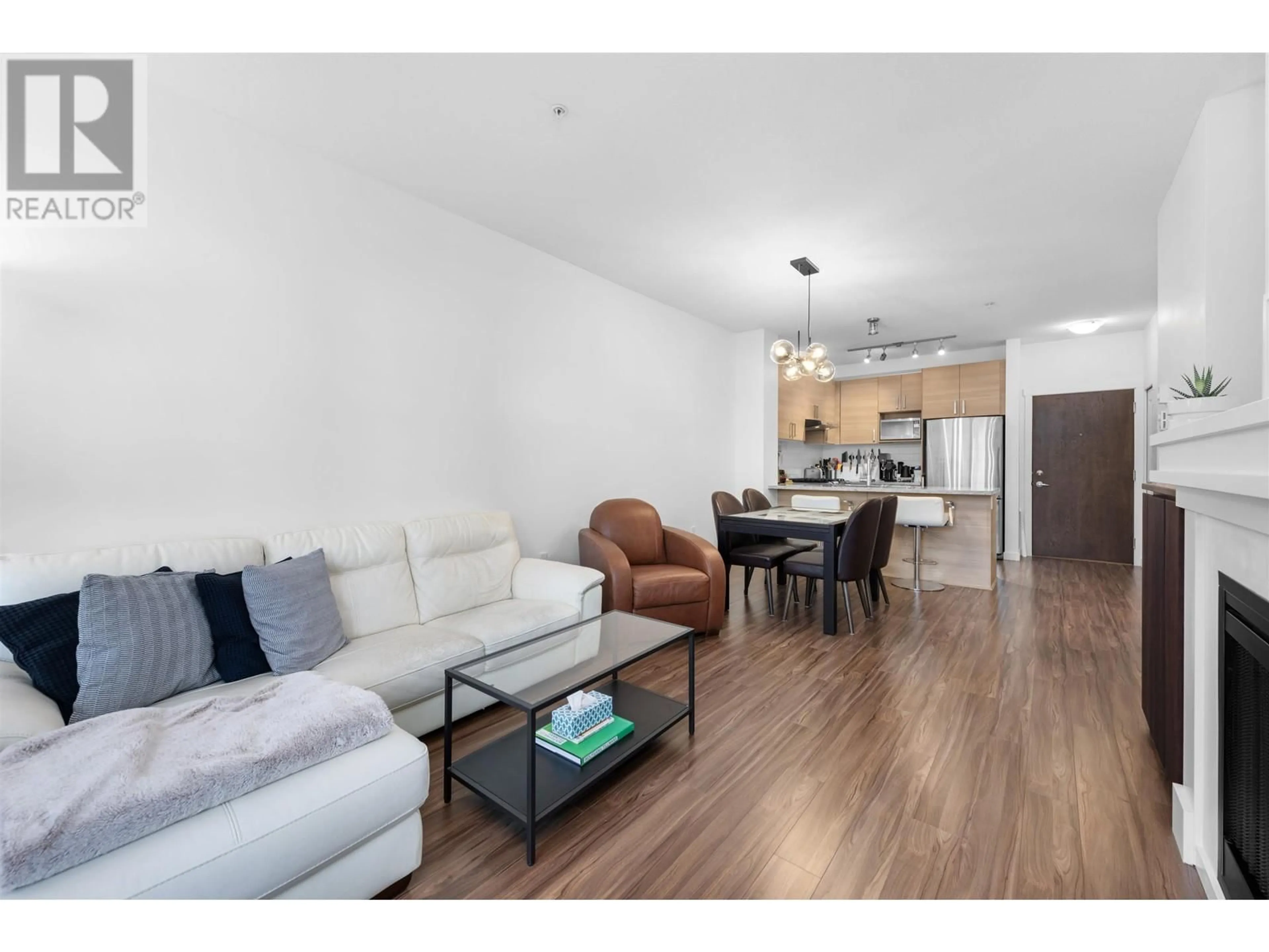 Living room with furniture, wood/laminate floor for 203 1150 KENSAL PLACE, Coquitlam British Columbia V3B0H4