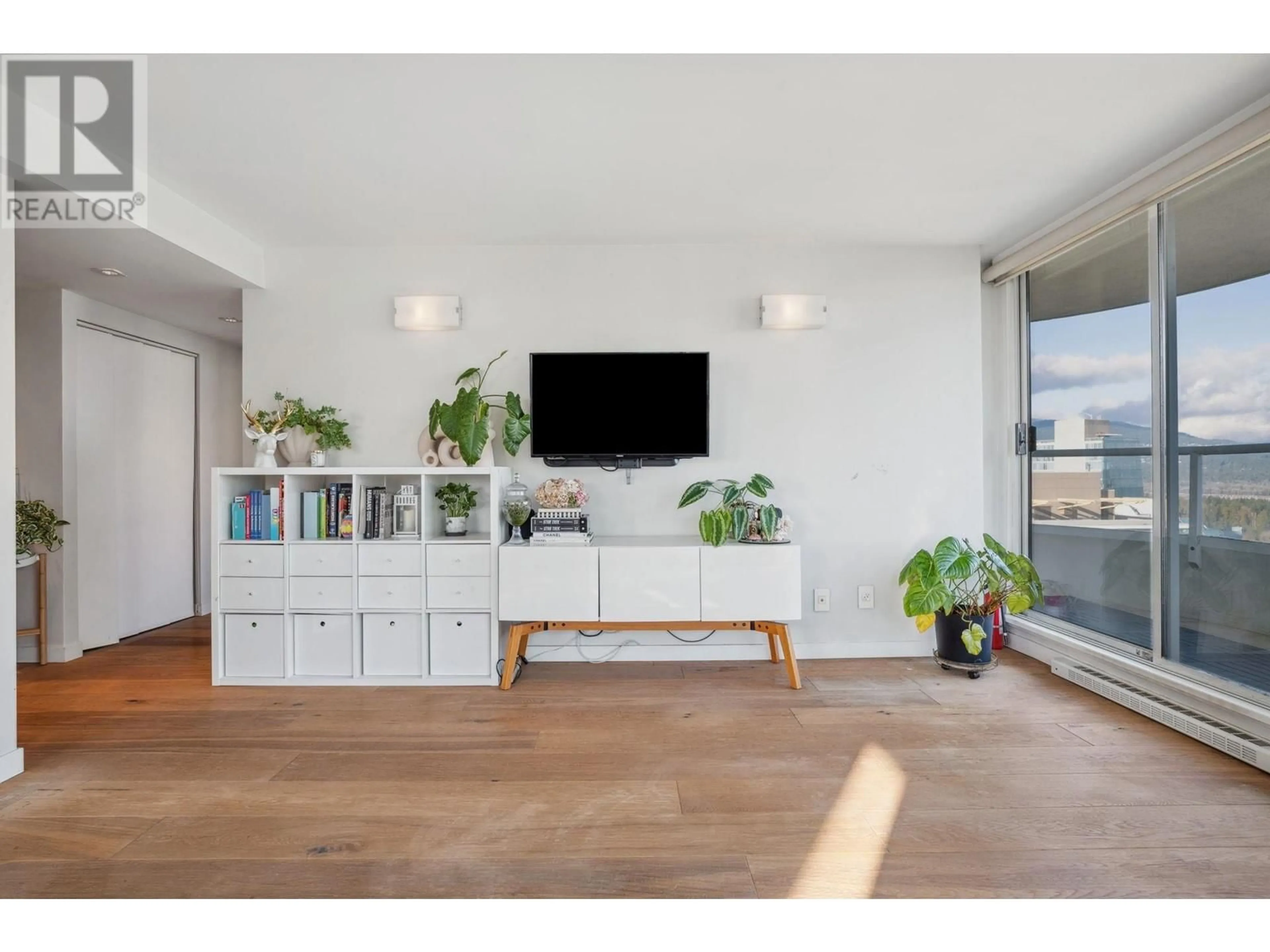 Living room with furniture, wood/laminate floor for 2702 717 JERVIS STREET, Vancouver British Columbia V6E4L5