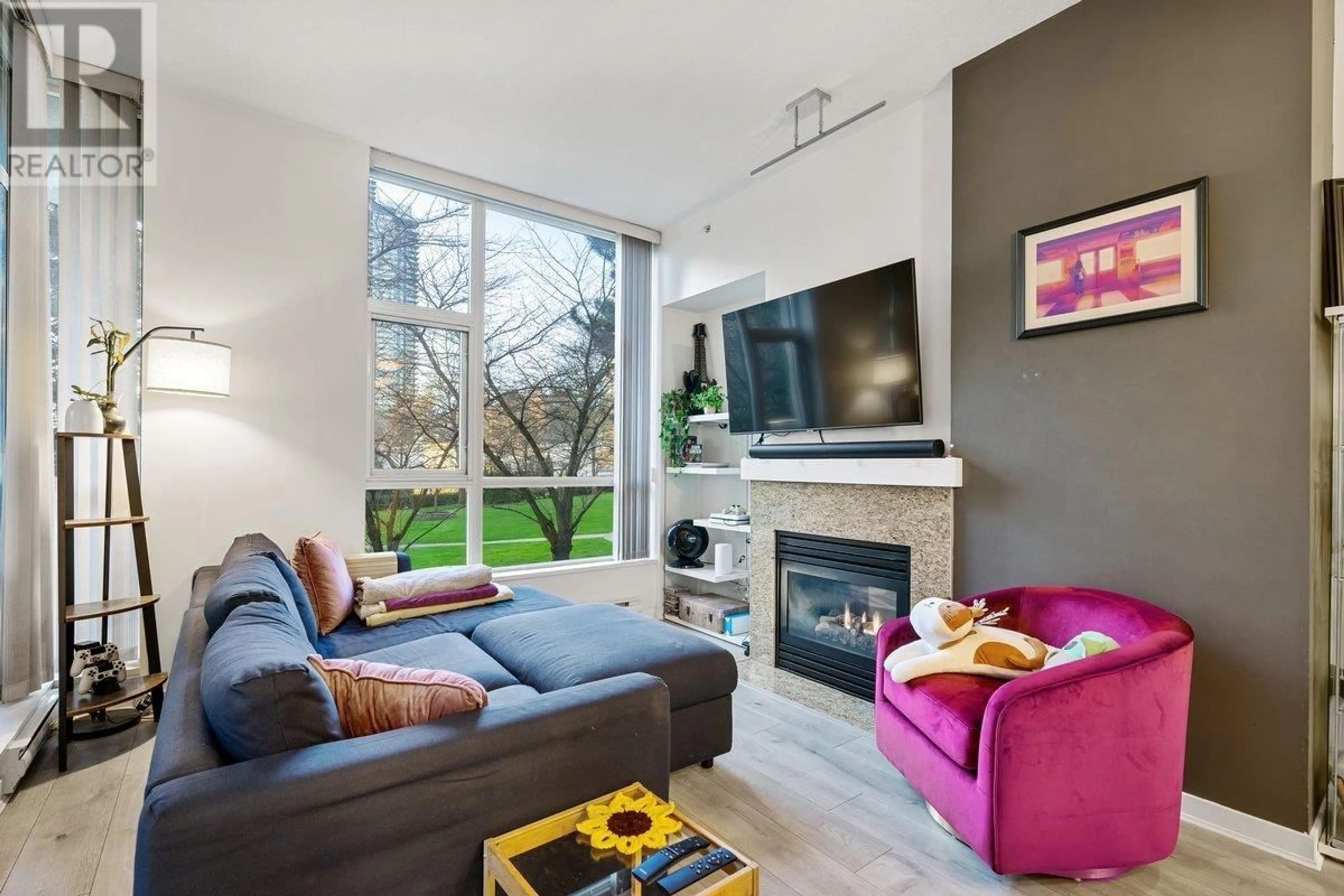 Living room with furniture, wood/laminate floor for 103 2138 MADISON AVENUE, Burnaby British Columbia V5C6T6