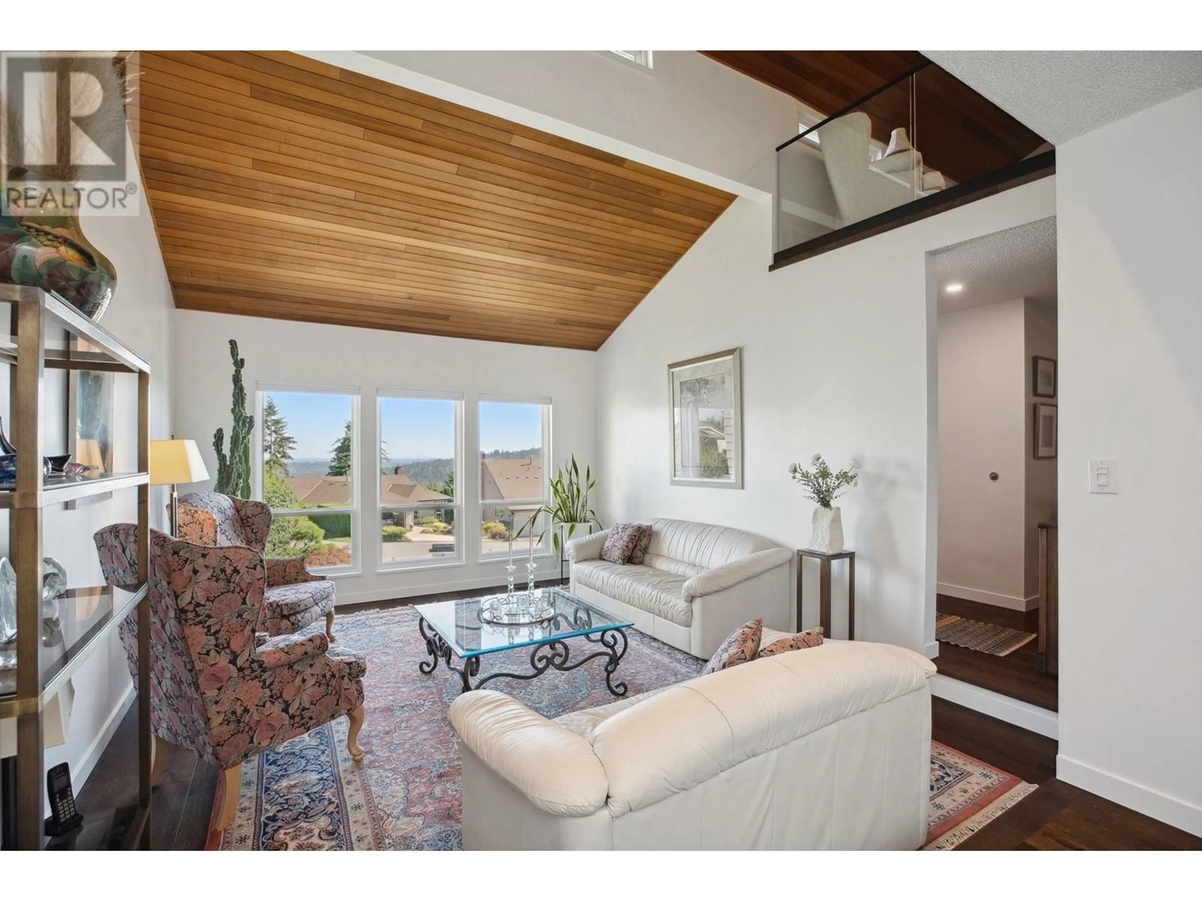 Living room with furniture, wood/laminate floor for 1613 HEMLOCK PLACE, Port Moody British Columbia V3H4A7