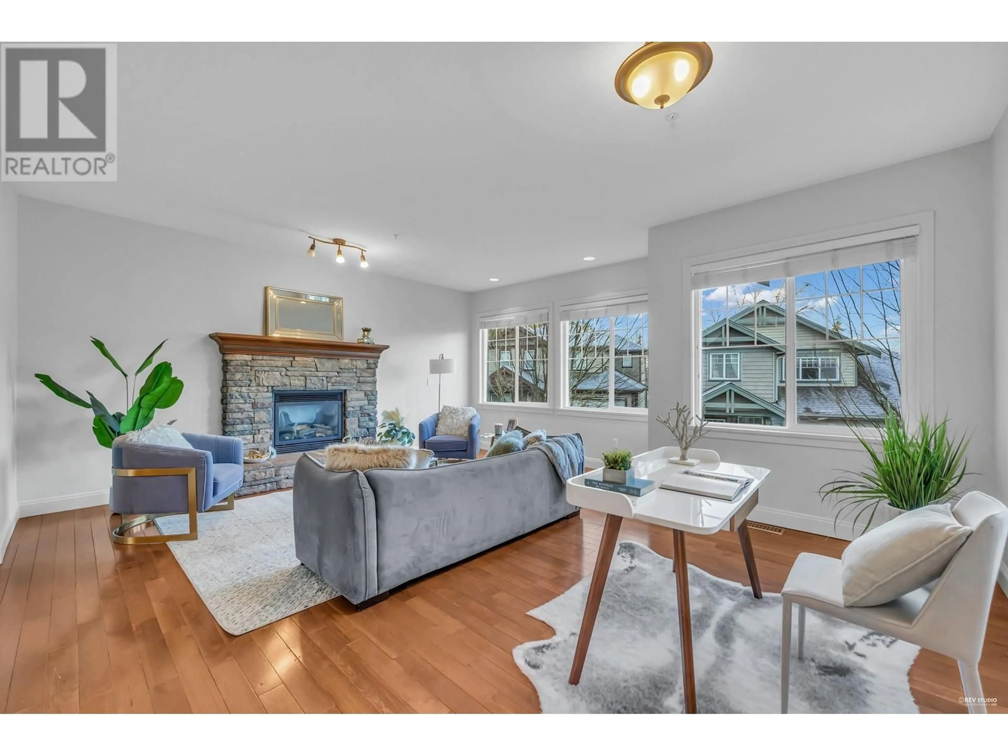 Living room with furniture, wood/laminate floor for 101 23925 116 AVENUE, Maple Ridge British Columbia V2W0C3