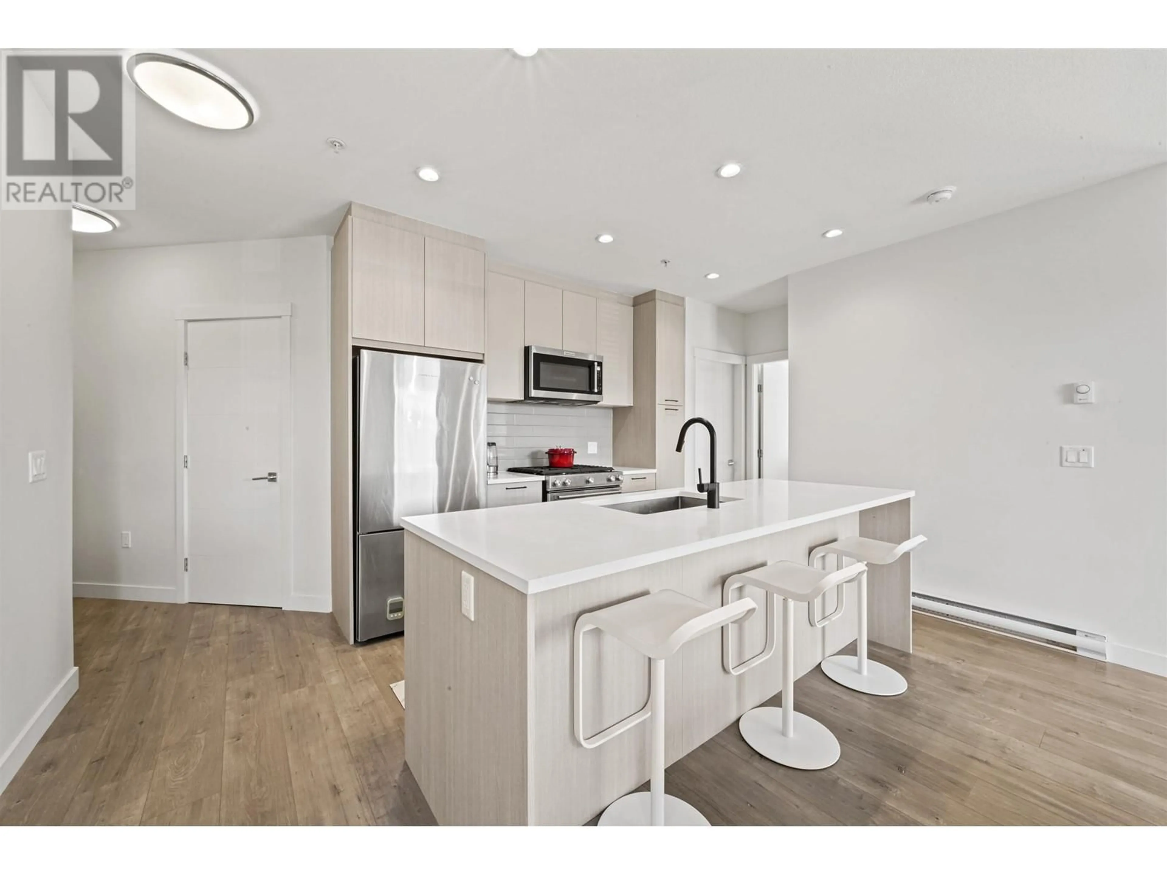 Open concept kitchen, unknown for 305 707 COMO LAKE AVENUE, Coquitlam British Columbia V6B0E3