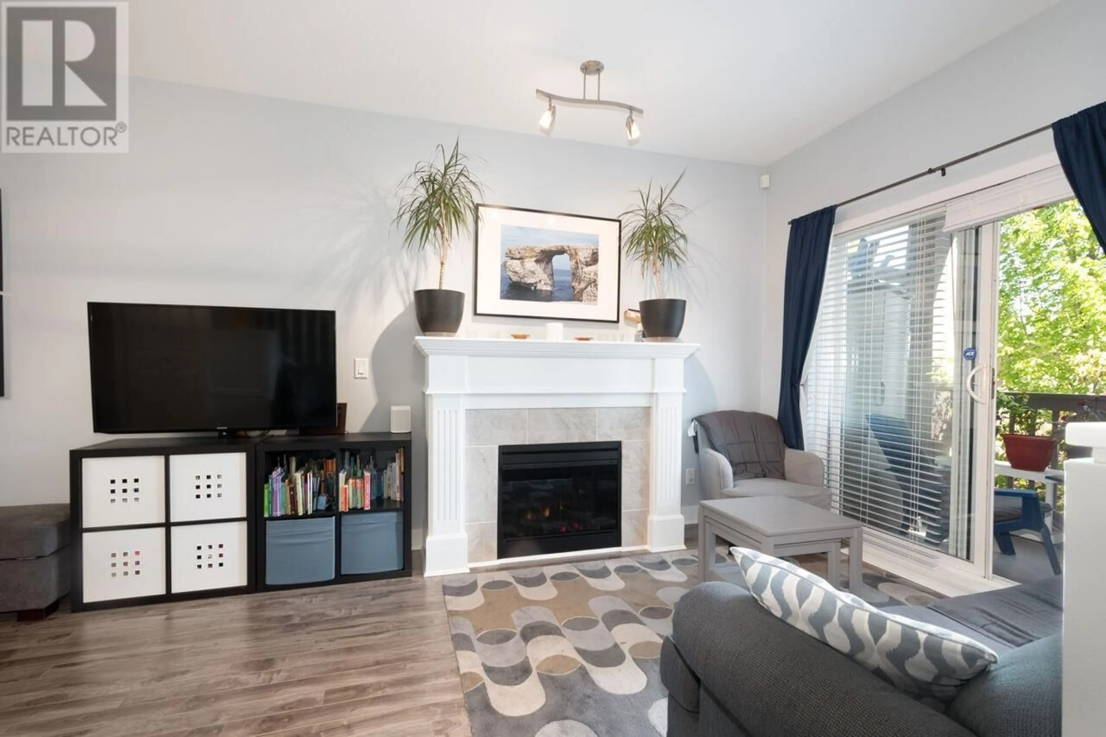 Living room with furniture, wood/laminate floor for 110 4438 ALBERT STREET, Burnaby British Columbia V5C2G2